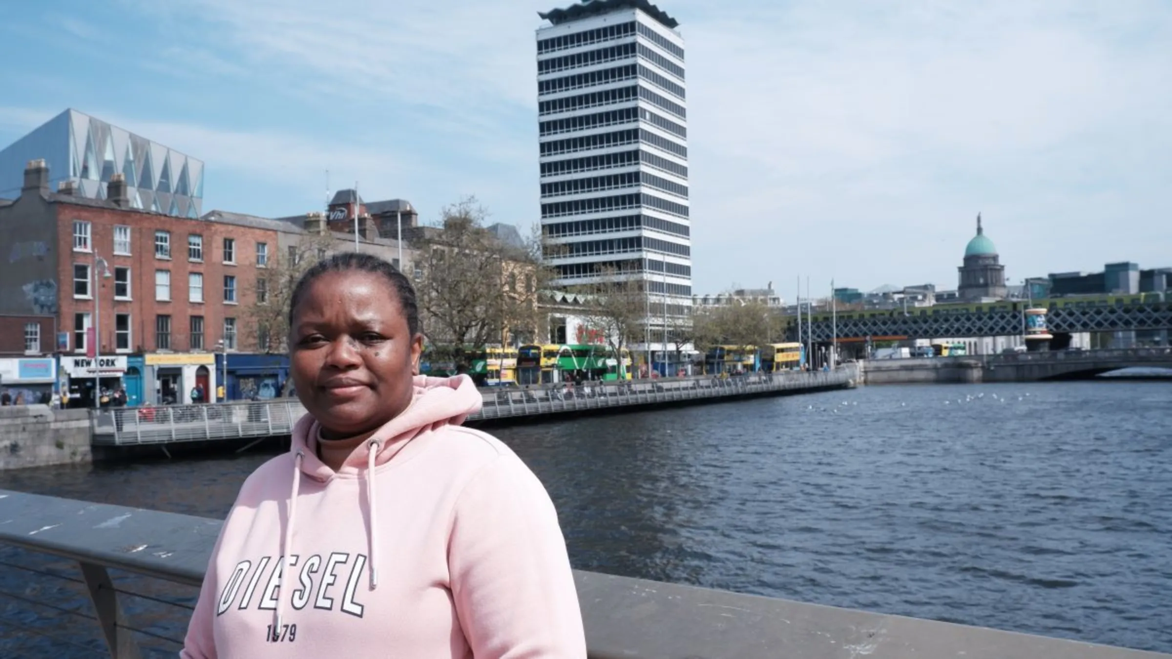 Sharon Mpofu, a refugee from Zimbabwe, poses for a portrait in the city centre in Dublin, Ireland, May 2023