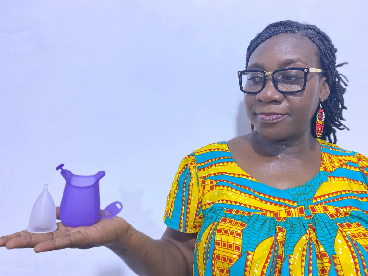 Awo Aidam Amenyah, founder and executive director of Child Online Africa displays a menstrual cup