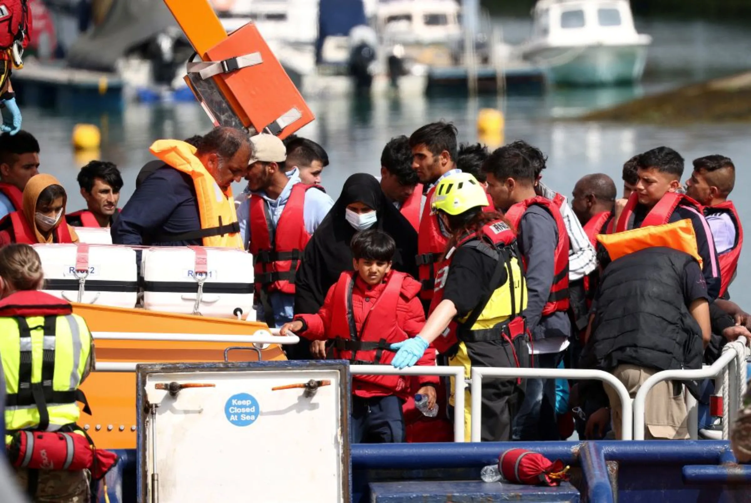 Migrants arrive at Dover harbour on board a Border Force vessel, after being rescued while attempting to cross the English Channel, in Dover, Britain, August 24, 2022. REUTERS/Henry Nicholls