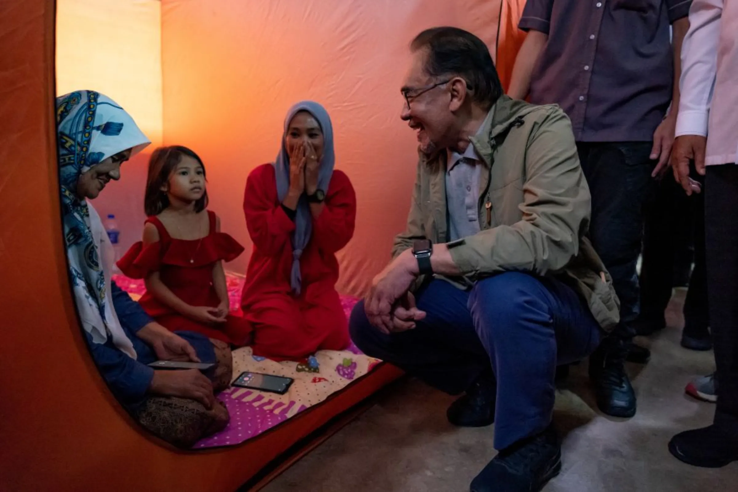 Malaysia's Prime Minister Anwar Ibrahim speaks to flood victims at a relief centre in Pasir Mas, Kelantan, Malaysia December 21, 2022