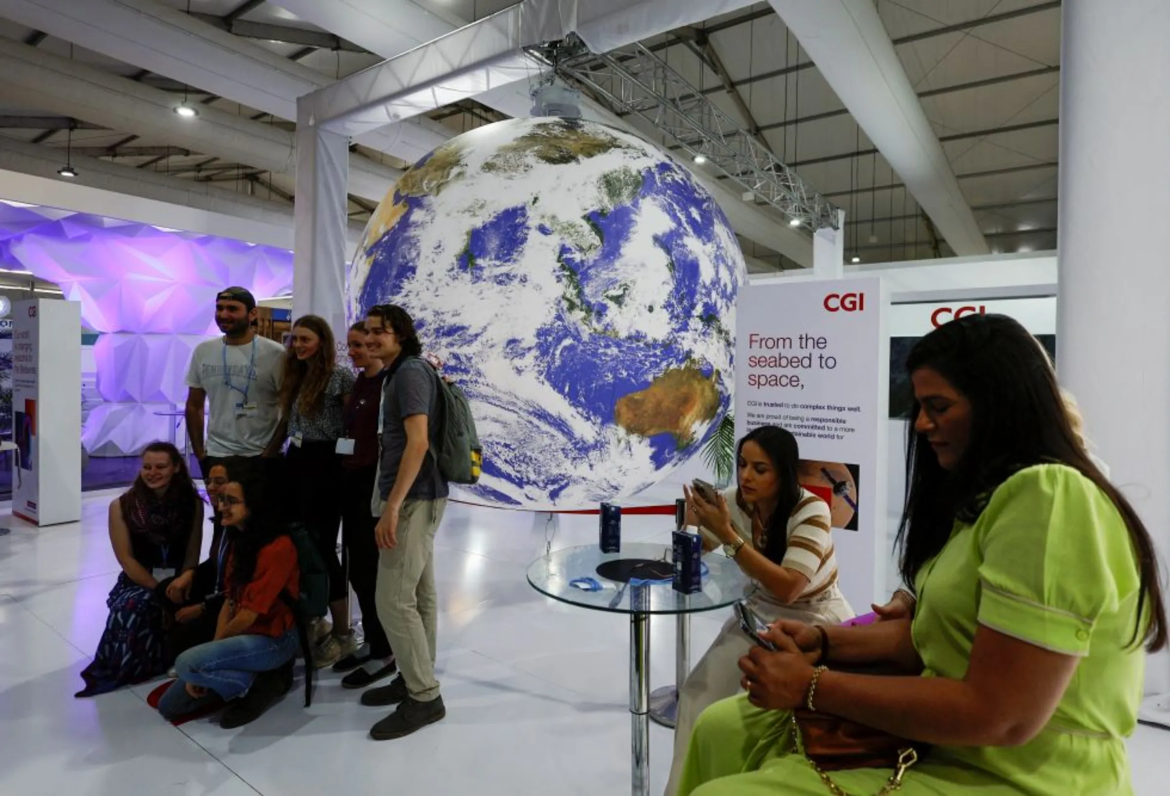 Attendees pose for a photo during the COP27 climate summit in Sharm el-Sheikh, Egypt November 16, 2022