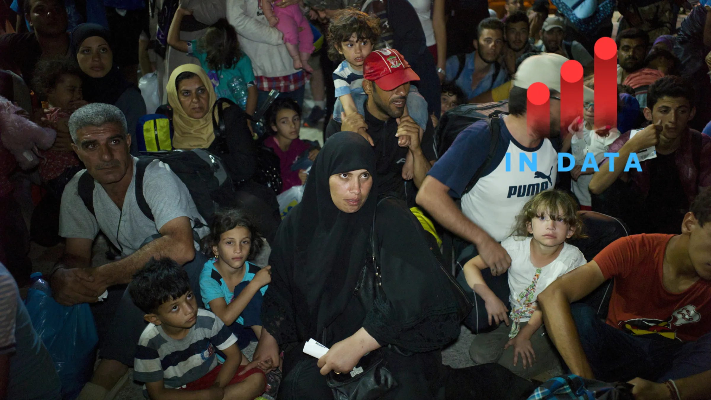 Refugees and migrants wait to board a passenger ship, at the port on the island of Lesbos, Greece September 7, 2015. REUTERS/Dimitris Michalakis