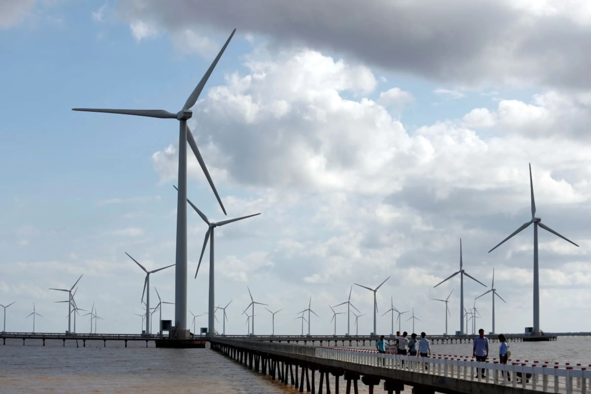 Power-generating windmill turbines are pictured at a wind park in Bac Lieu province, Vietnam, July 8, 2017. REUTERS/Kham