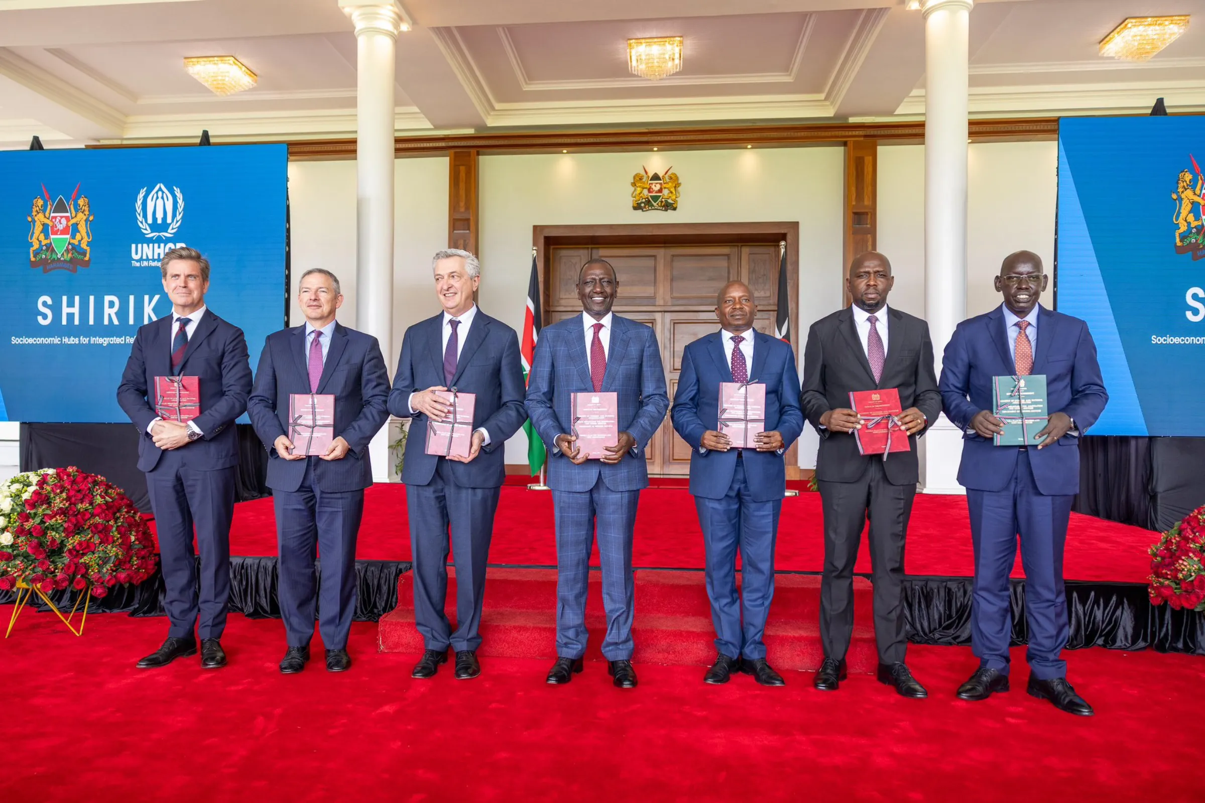 President William Ruto of Kenya (centre) poses with other dignitaries during the official launch of the Shirika Plan at State House, Nairobi. March 28, 2025. Kenyan Presidency/Handout via Thomson Reuters Foundation