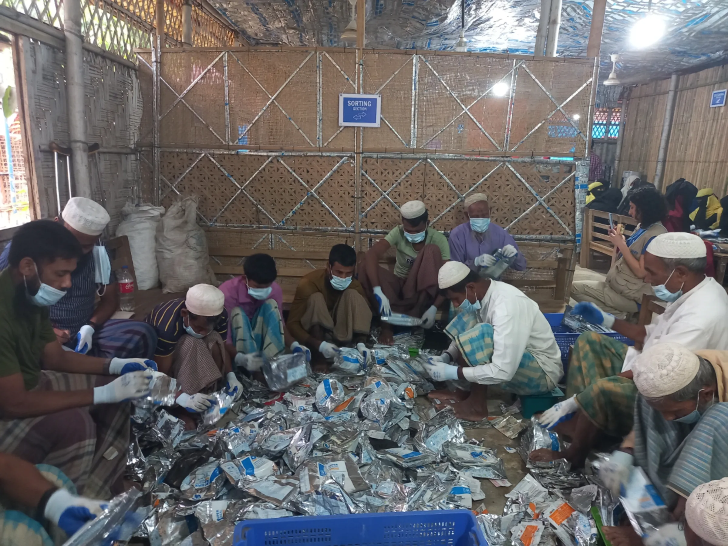 Rohingya men produce bags and handicrafts from waste material, May 8, 2024, Cox's Bazar, Bangladesh. Thomson Reuters Foundation/Md Tahmid Zami