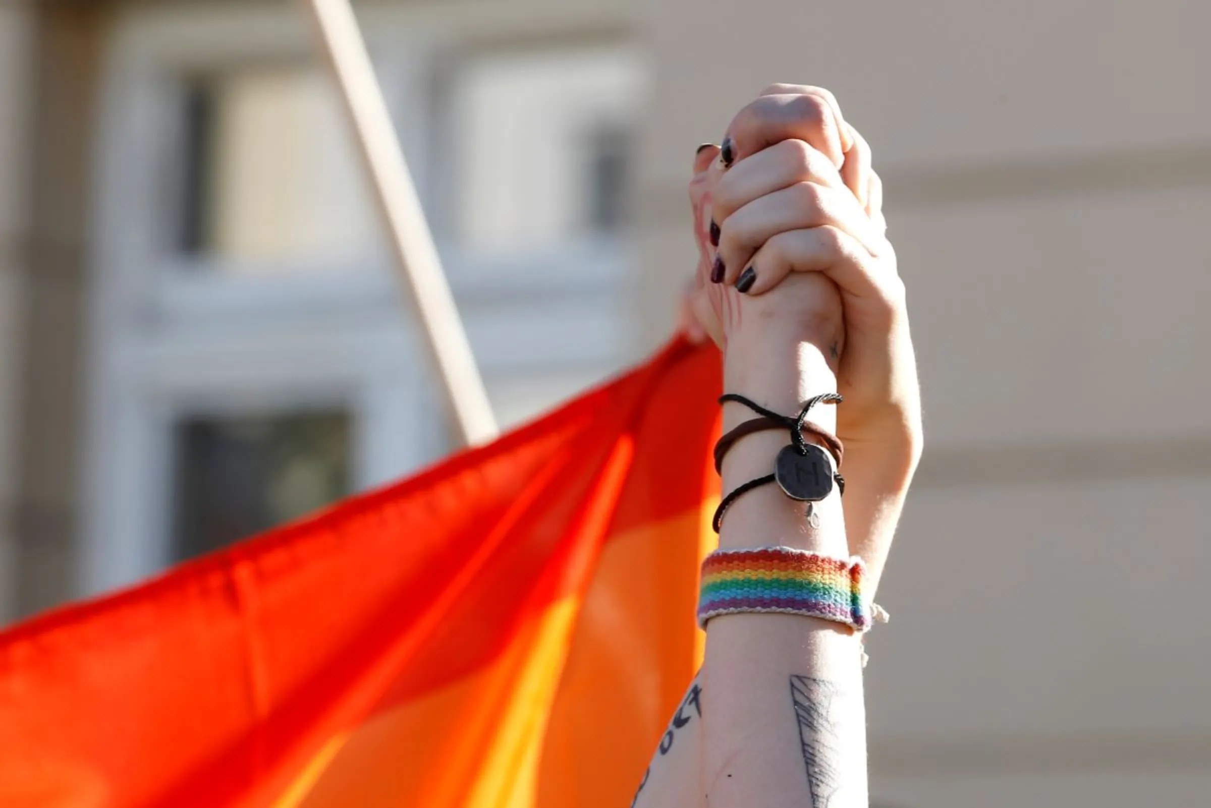 Pro-LGBT demonstrators hold hands as Polish nationalists gather to protest against what they call 'LGBT aggression' on Polish society, in Warsaw, Poland August 16, 2020. REUTERS/Kacper Pempel