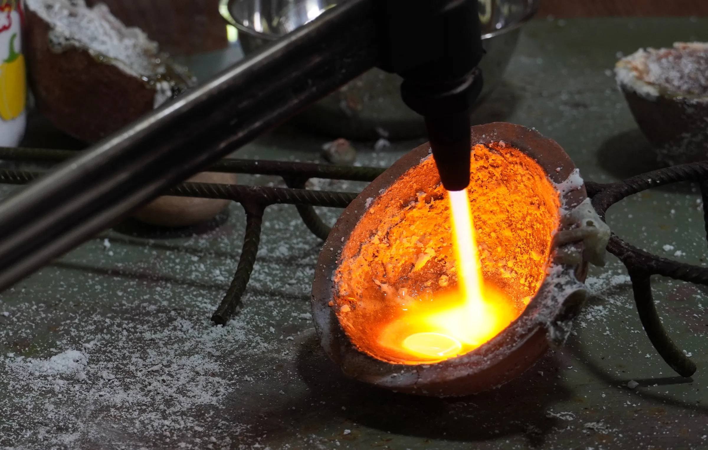 A woman smelts gold separated using a shaking table, in Laberinto, Madre de Dios, Peru. Thomson Reuters Foundation/Dan Collyns
