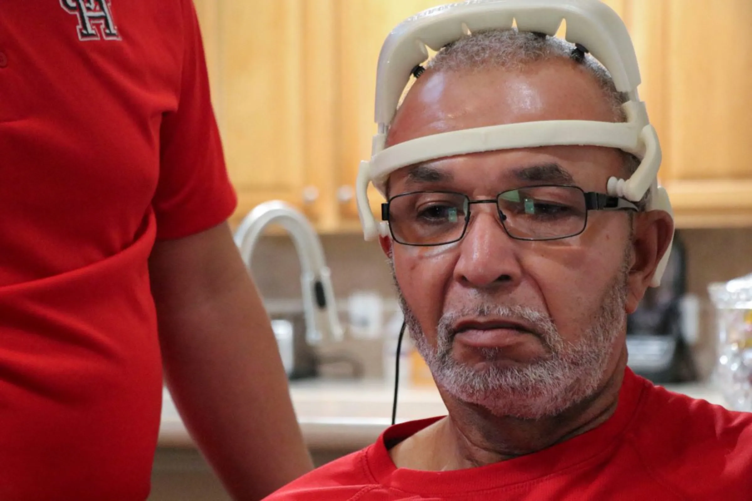 A stroke survivor wears a brain-computer interface at his home, in Richmond, Texas, U.S., on September 21, 2023. REUTERS/Evan Garcia