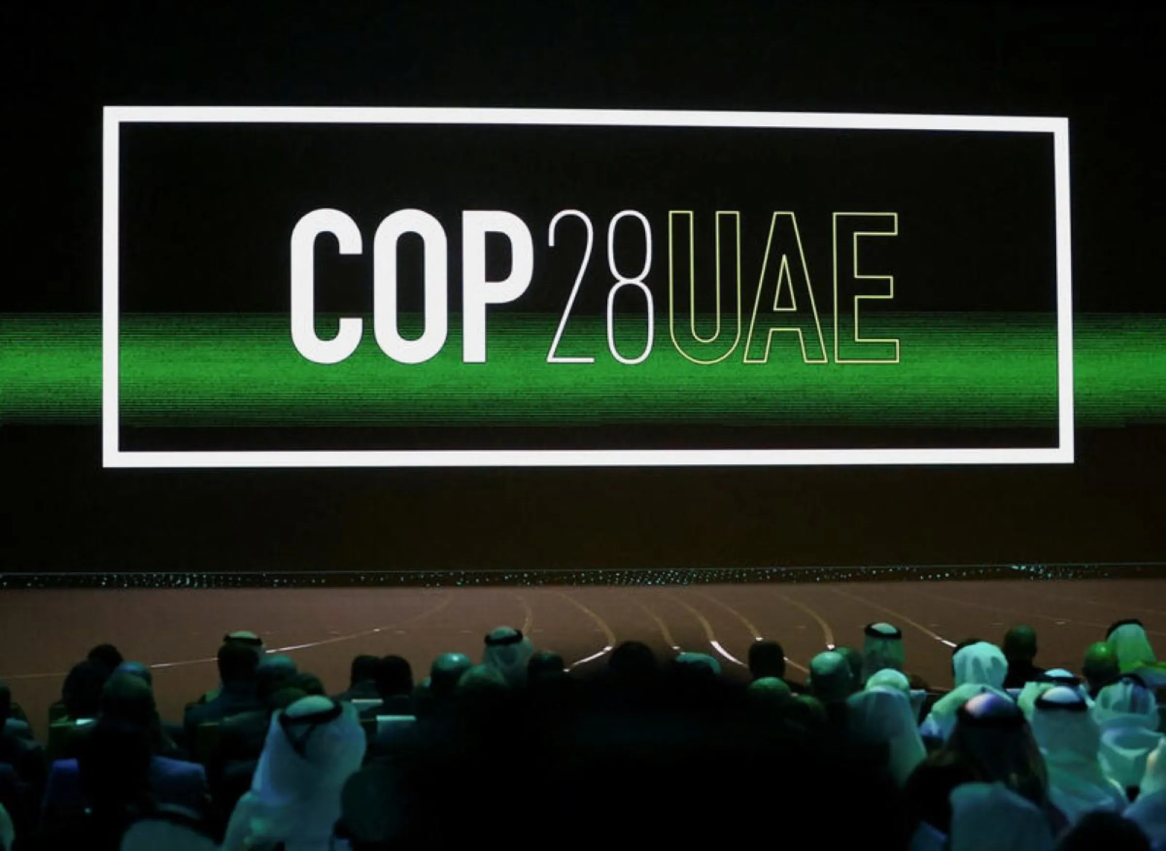 The 'Cop28 UAE' logo is displayed on the screen during the opening ceremony of Abu Dhabi Sustainability Week (ADSW) under the theme of 'United on Climate Action Toward COP28', in Abu Dhabi, UAE, January 16, 2023. REUTERS/Rula Rouhana