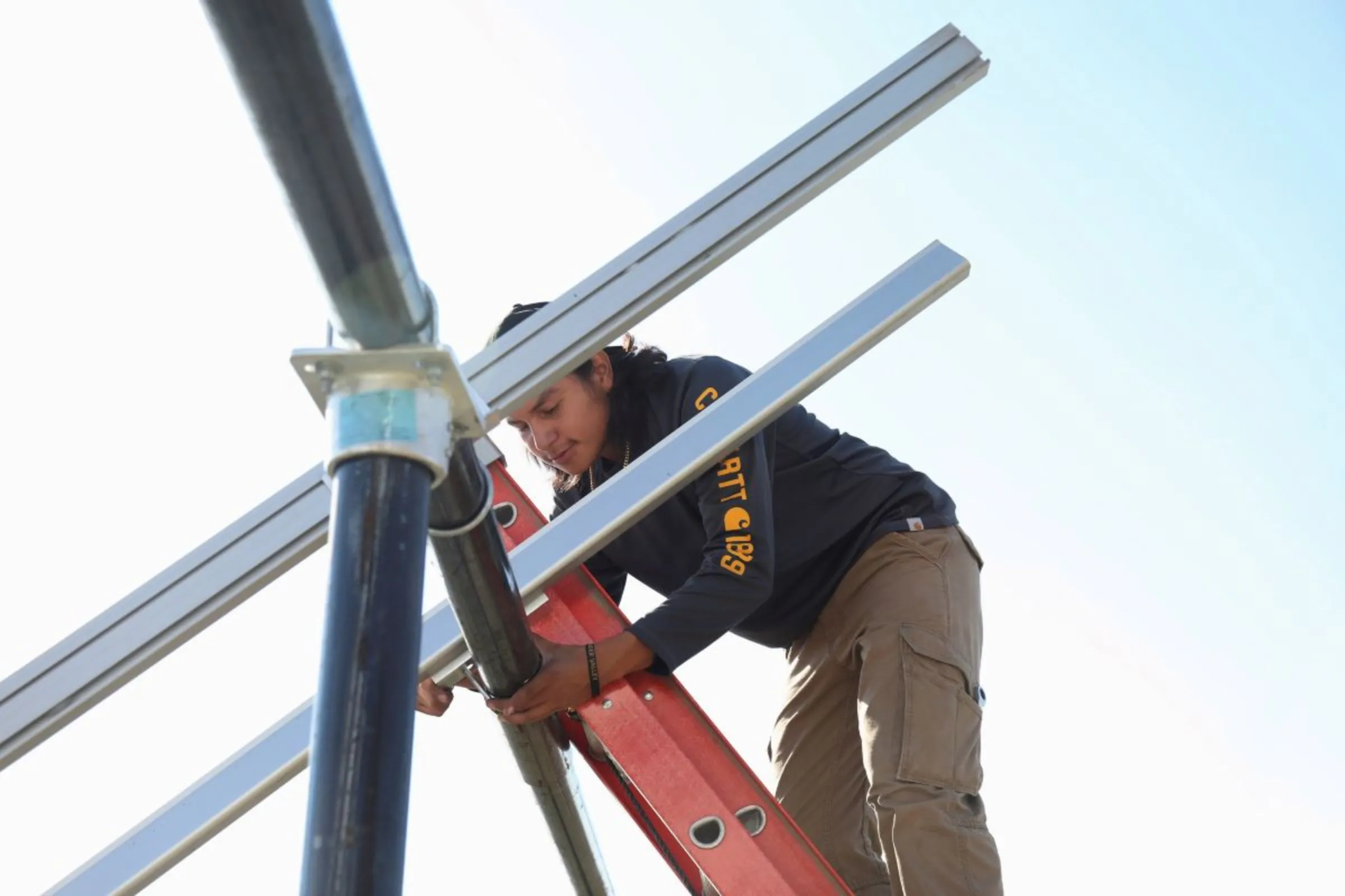 A person installs solar panels on the Pine Ridge reservation in South Dakota, U.S., September 24, 2018. Picture taken September 24, 2018. REUTERS/Emilie Richardson