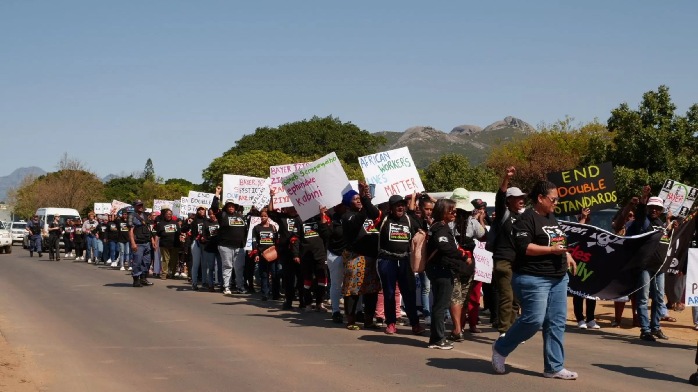 Female farmworkers march through the streets demanding an end to the import and use of  EU-banned pesticides in South Africa, Paarl, South Africa, September 8, 2023. Thomson Reuters Foundation/Kim Harrisberg