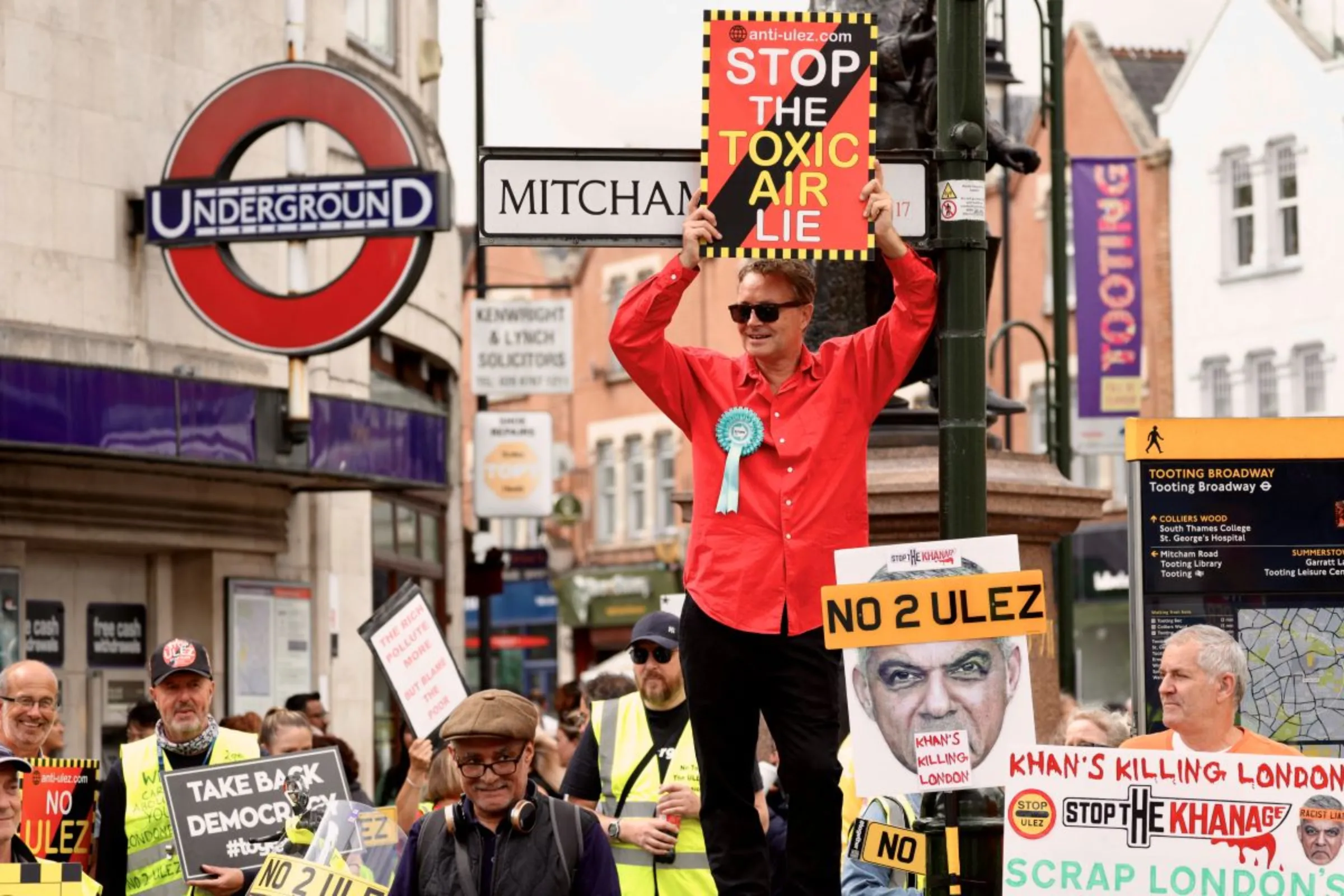 People protest at a demonstration at Tooting Broadway against the expansion of London's Ultra Low Emissions Zone (ULEZ), which involves hundreds of cameras installed on London's roads to enforce a clean-air zone that imposes a daily charge on some motorists, in London, Britain August 26, 2023. REUTERS/Kevin Coombs