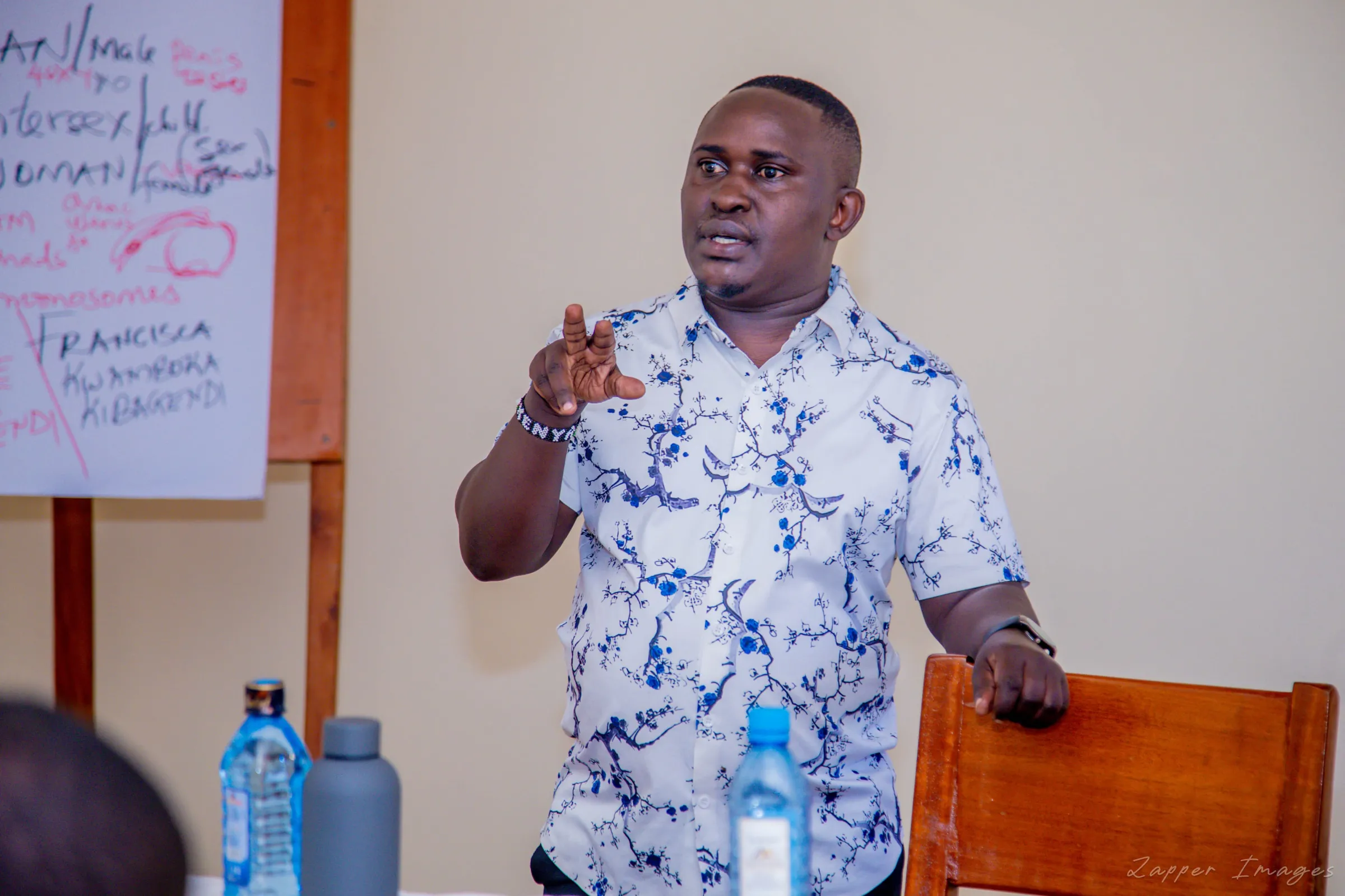 Frankie Kibagendi, programmes lead at Jinsiangu, speaking on intersex rights at an event in Kisii County, Kenya, May 29, 2025. Thomson Reuters Foundation/Peter Ongera