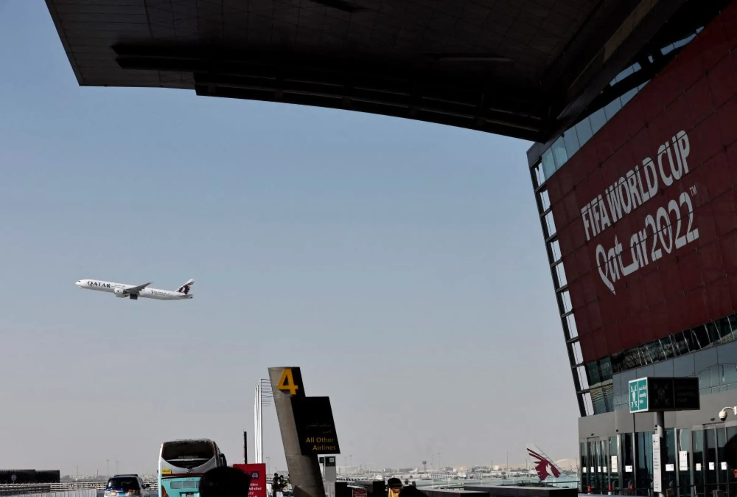A Qatar World Cup promotion is seen with a Qatar Airways aeroplane in flight at Hamad International Airport ahead of the World Cup, Doha, Qatar. November 10, 2022. REUTERS/Hamad I Mohammed