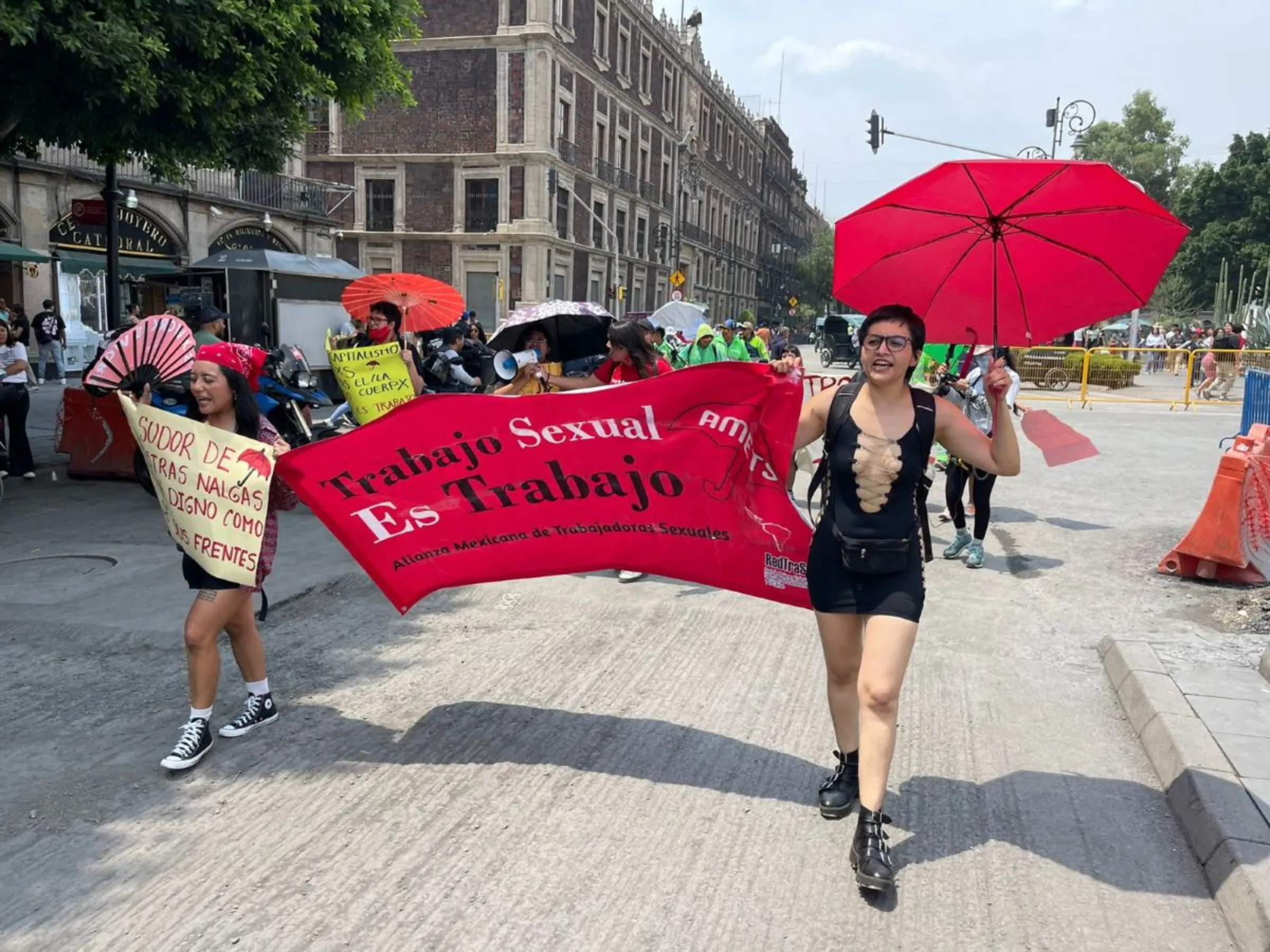 Members from CLaP march to demand social protections for sex workers in Mexico City, Mexico, on May 1, 2024. ProDESC/handout via Thomson Reuters Foundation.