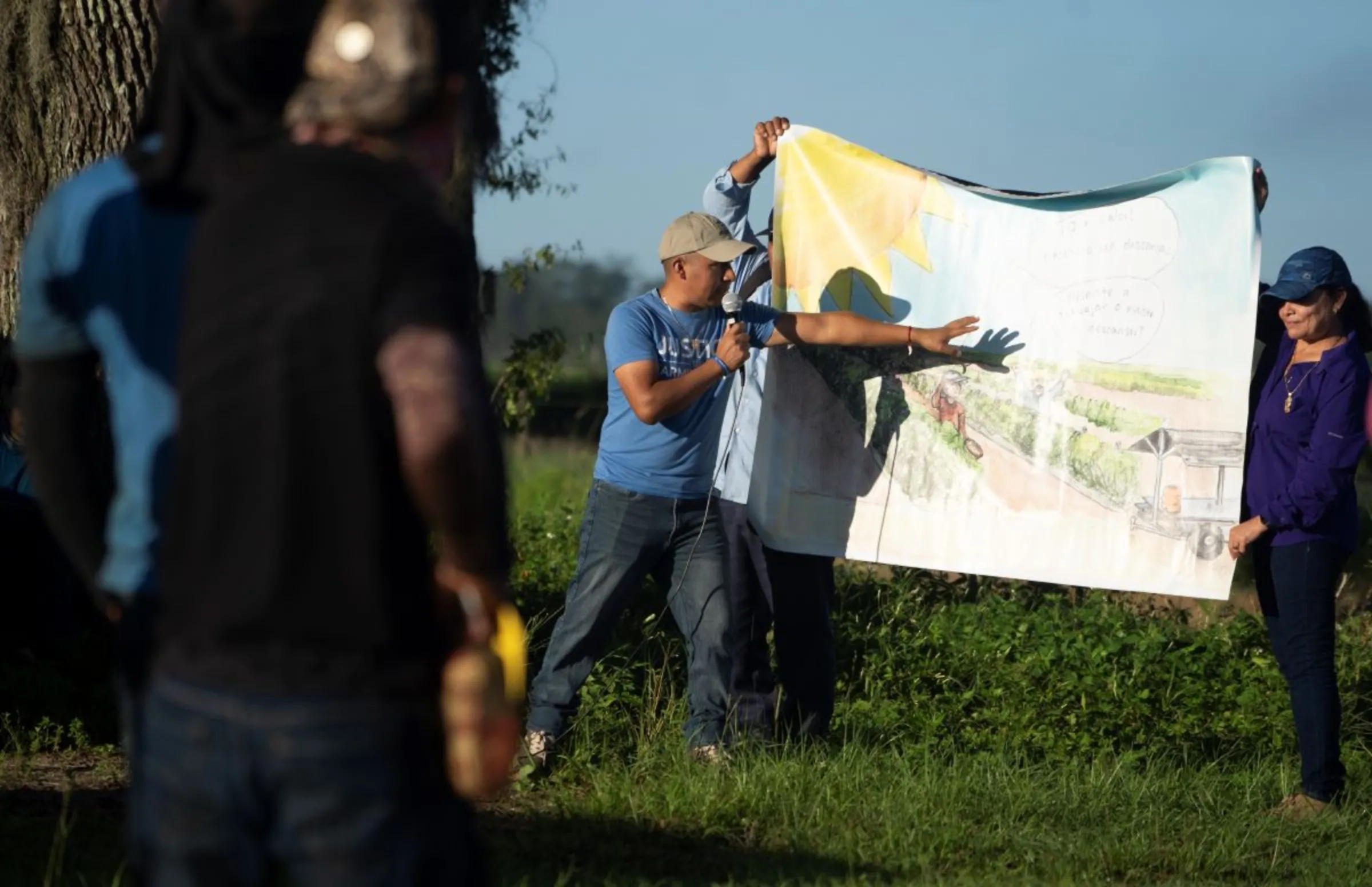 Workers carry out peer education on heat stress protections at a farm in the U.S. state of Georgia in December 2022. Fair Food Program/Handout via Thomson Reuters Foundation.