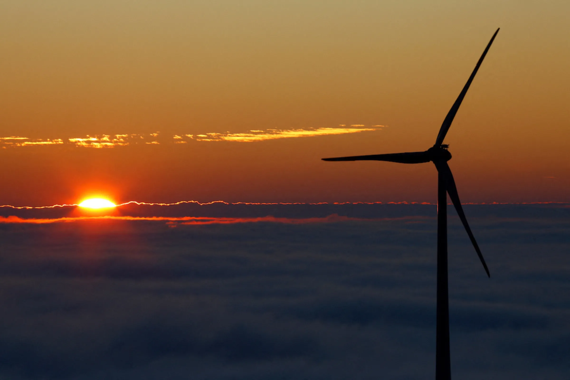 A wind turbine stands out against the sky as the sun sets over the Black Forest Brandenkopf lookout near Oberharmersbach, Germany, November 13, 2022. REUTERS/Joachim Herrmann