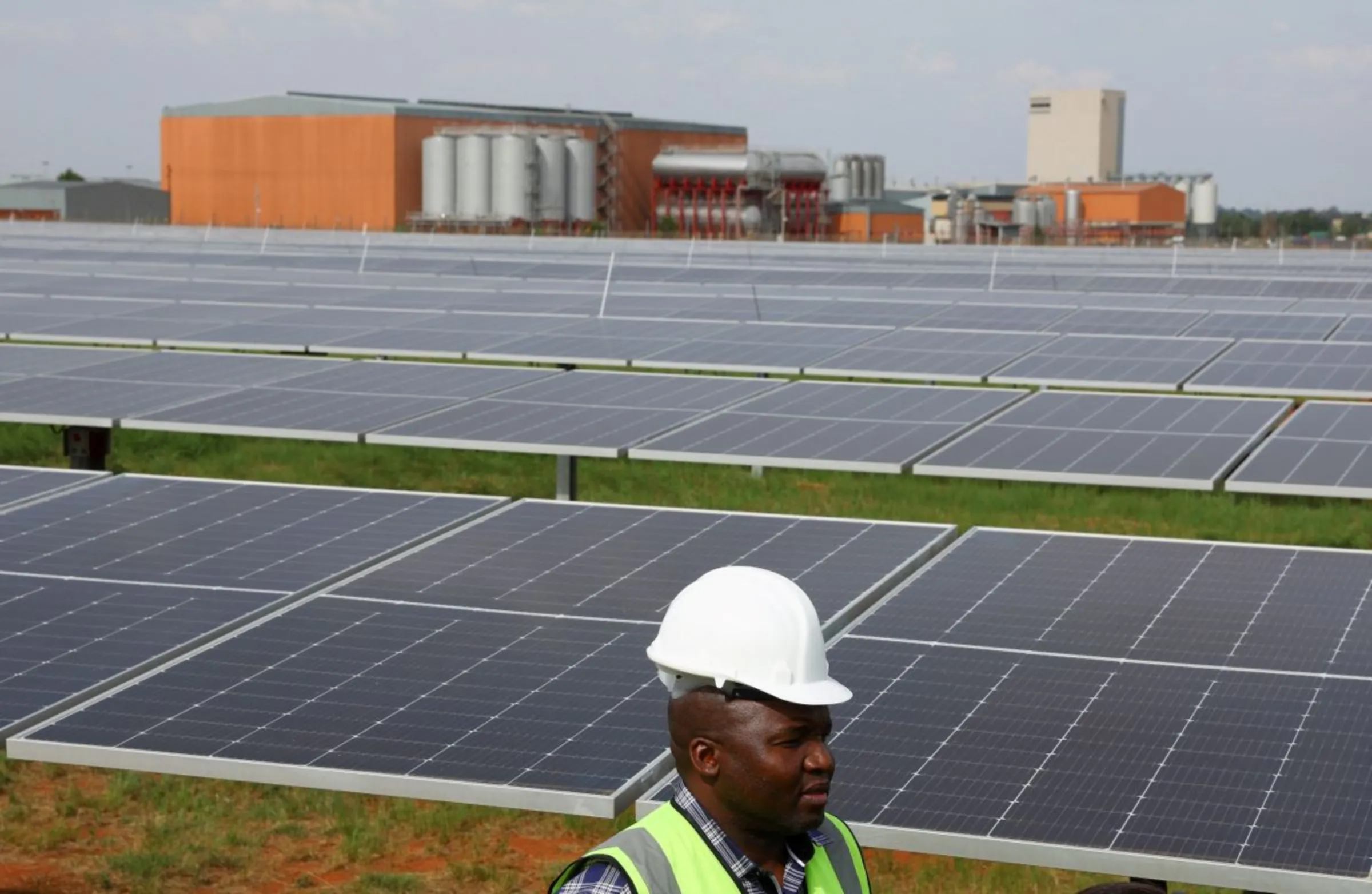 A visitor is seen at the new solar power plant of the South African arm of Heineken, the largest freestanding solar plant powering a brewery in South Africa, at the company's Sedibeng, Midvaal brewery in Johannesburg, South Africa, October 26, 2022. REUTERS/Siphiwe Sibeko