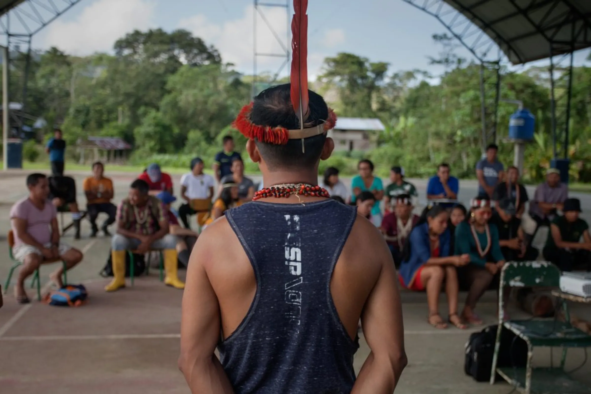 Opi Nenquimo, an indigenous leader of the Pastaza Waorani people, addresses his community at a workshop in a rainforest riverside village in the province of Pastaza, Ecuador, on April 26, 2022