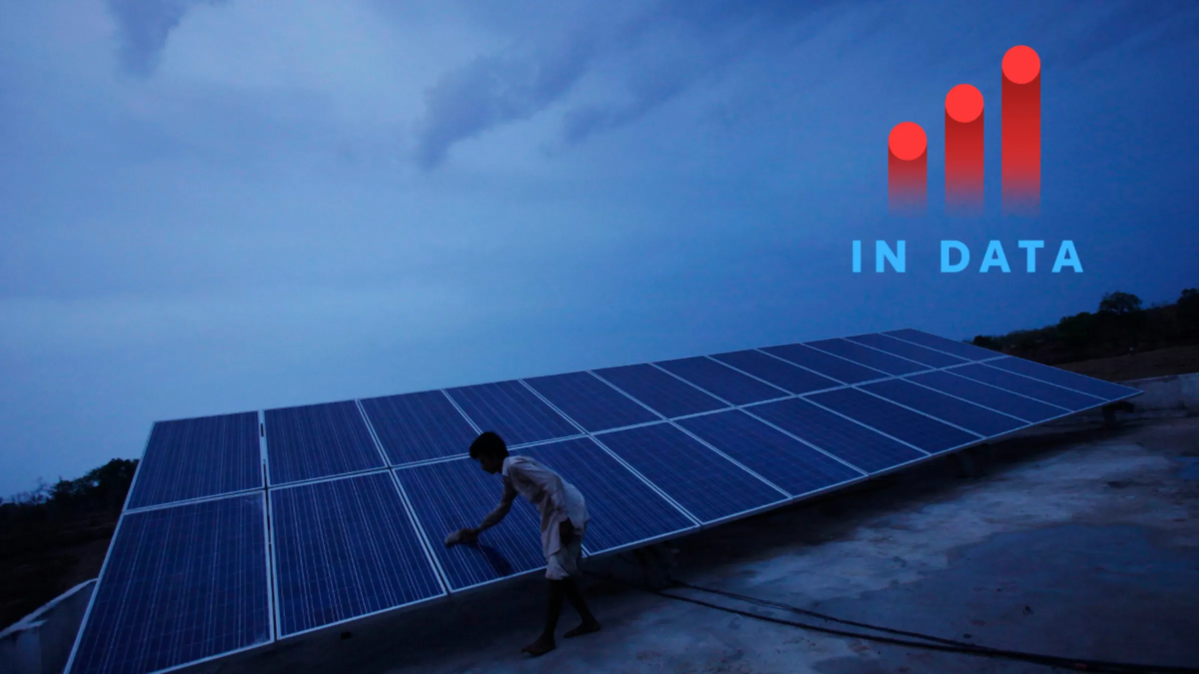 A man cleans panels installed at a solar plant at Meerwada village of Guna district in the central Indian state of Madhya Pradesh June 18, 2012. REUTERS/Adnan Abidi