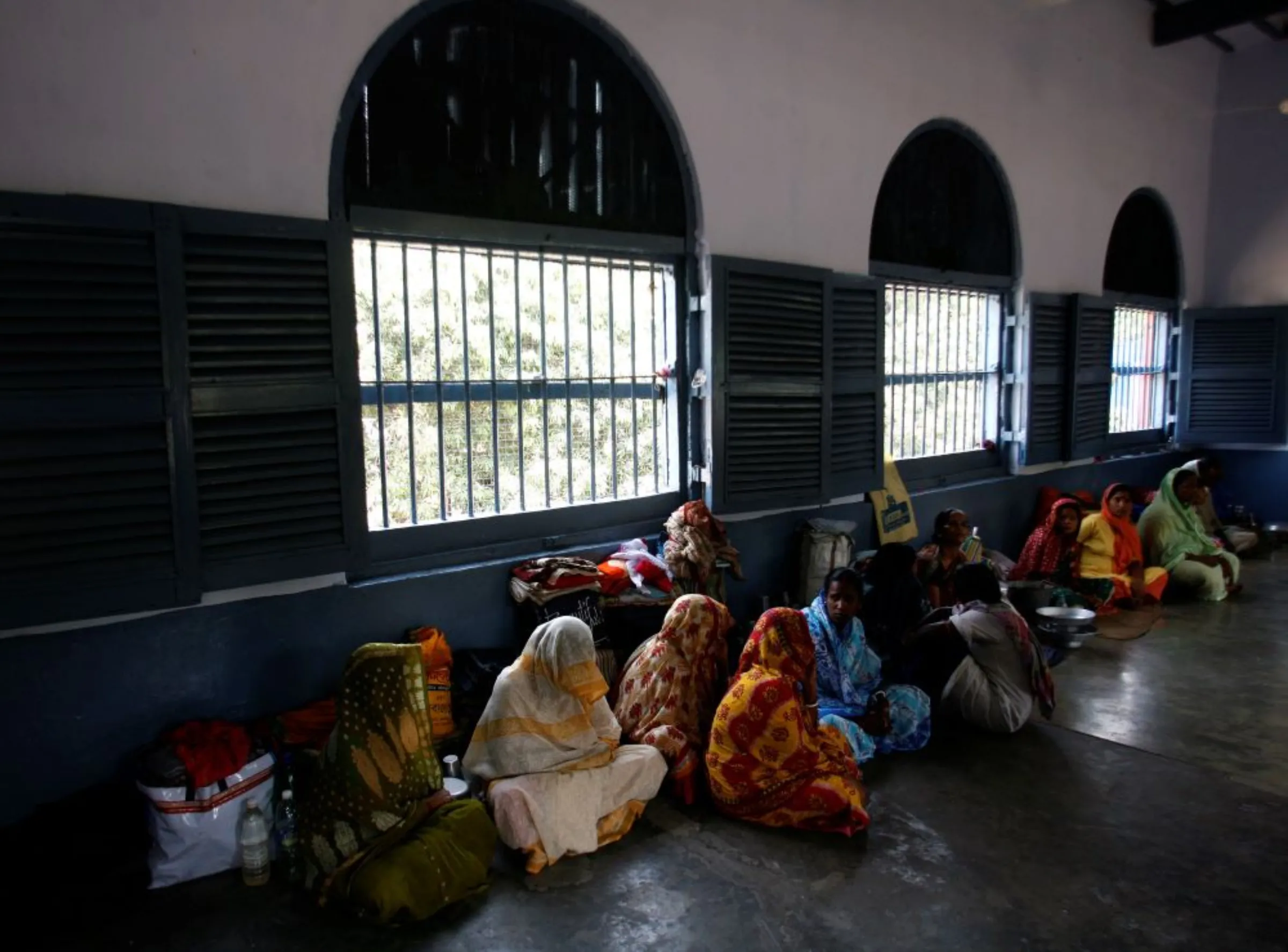 Female prisoners sit inside their cell in the eastern Indian city of Kolkata March 26, 2008