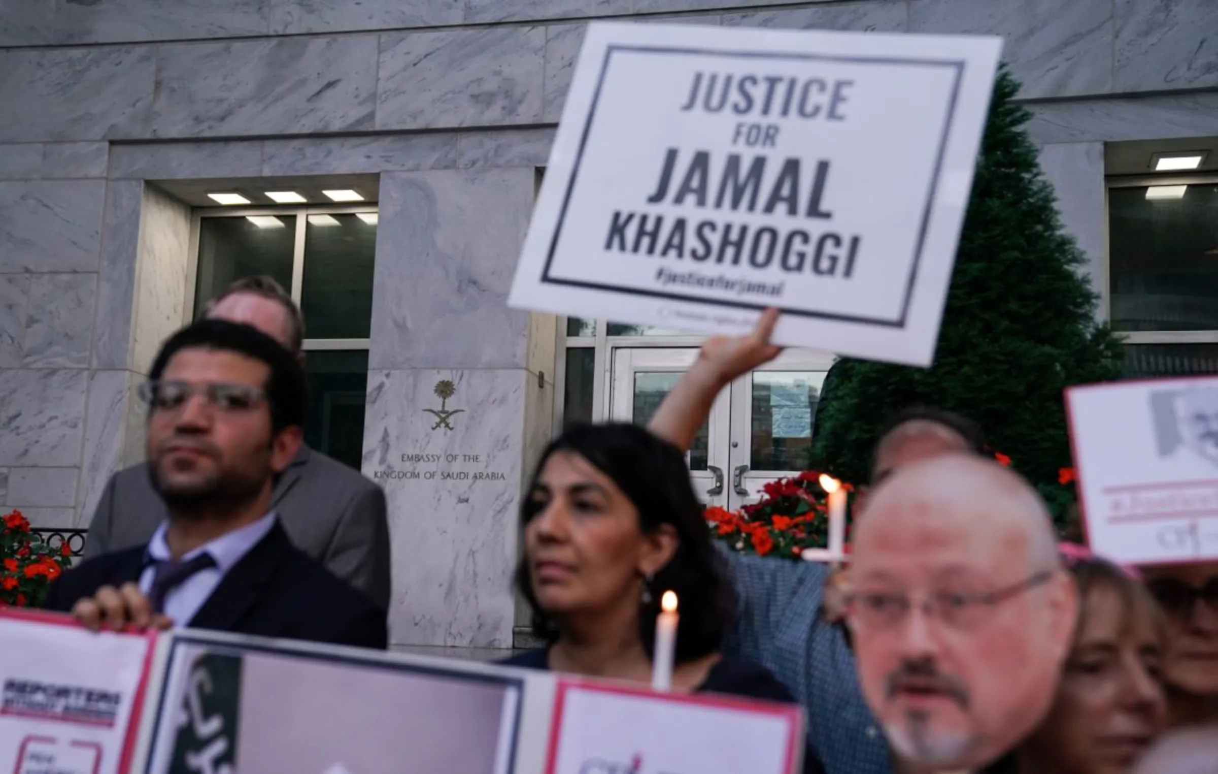Press freedom activists hold a vigil in front of the Saudi Embassy to mark the anniversary of the killing of journalist Jamal Khashoggi at the kingdom's consulate in Istanbul, Wednesday evening in Washington, U.S., October 2, 2019. REUTERS/Sarah Silbiger