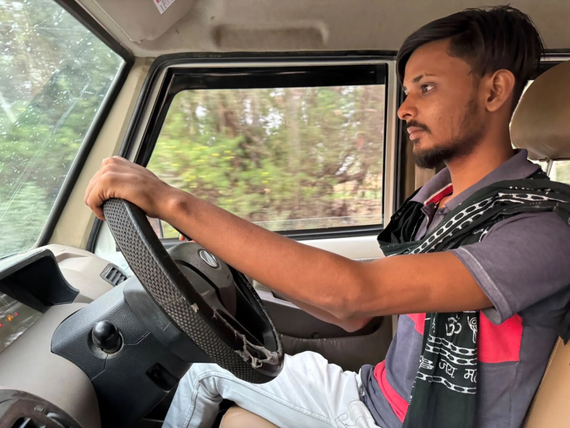 First-time voter Mohit Gautam is pictured driving in Banda, India, May 15, 2024. Thomson Reuters Foundation/Bhasker Tripathi