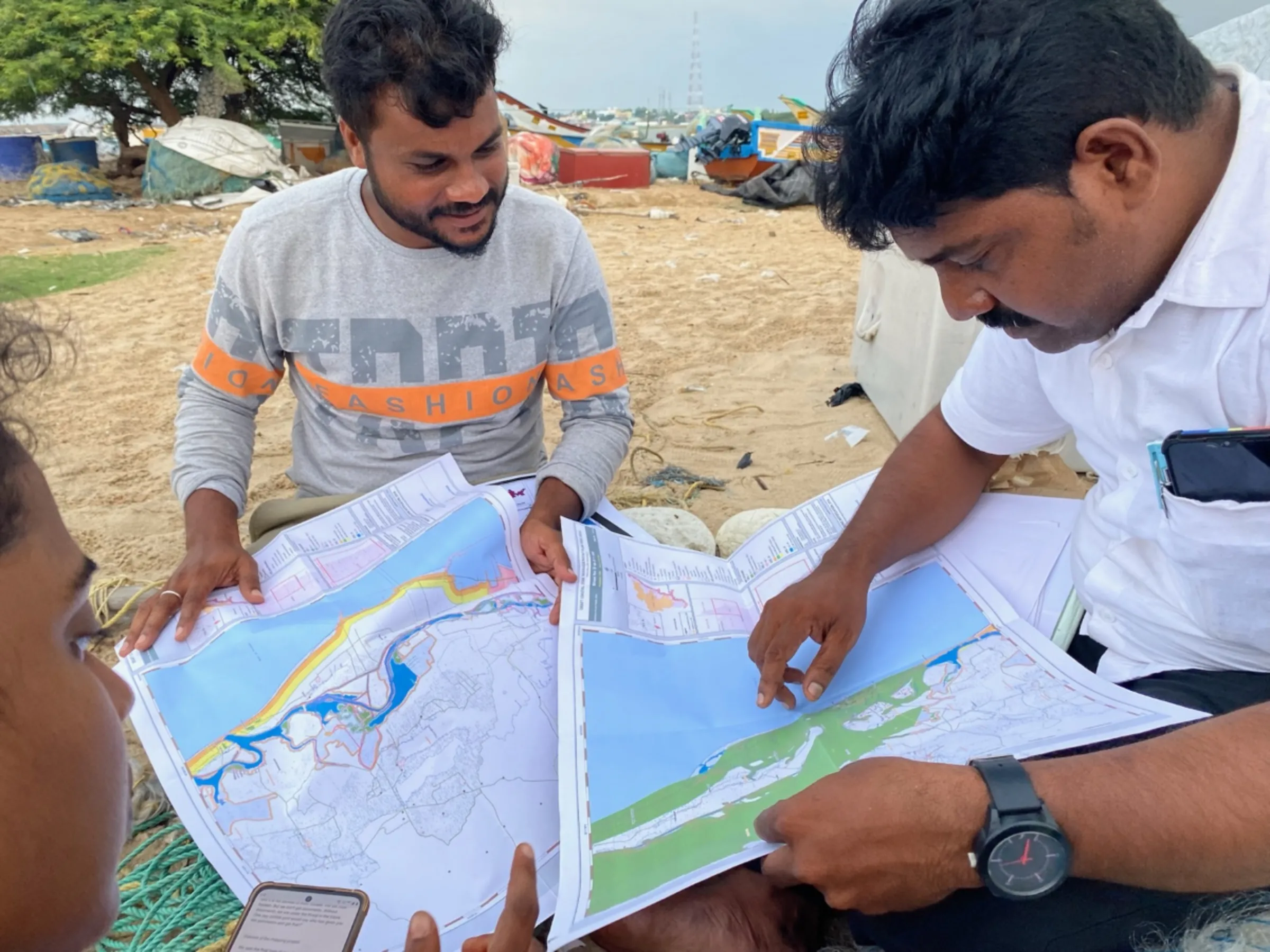 Bharath S Raji and P Mahendran point out discrepancies in government maps in Gunankuppam, near Chennai, India. July 14, 2023