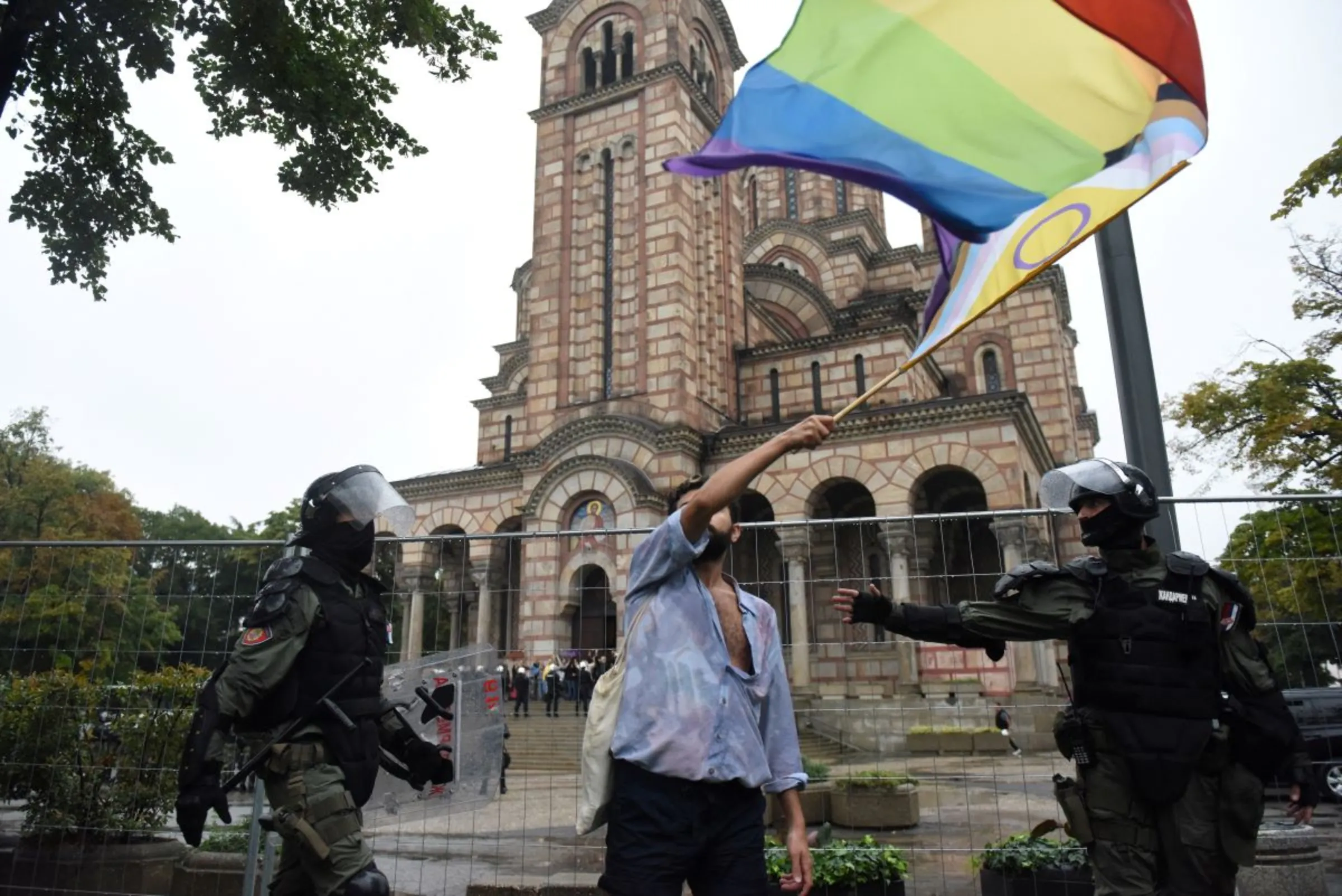 A person waves a flag during the European LGBTQ pride march in Belgrade, Serbia, September 17, 2022. REUTERS/Zorana Jevtic