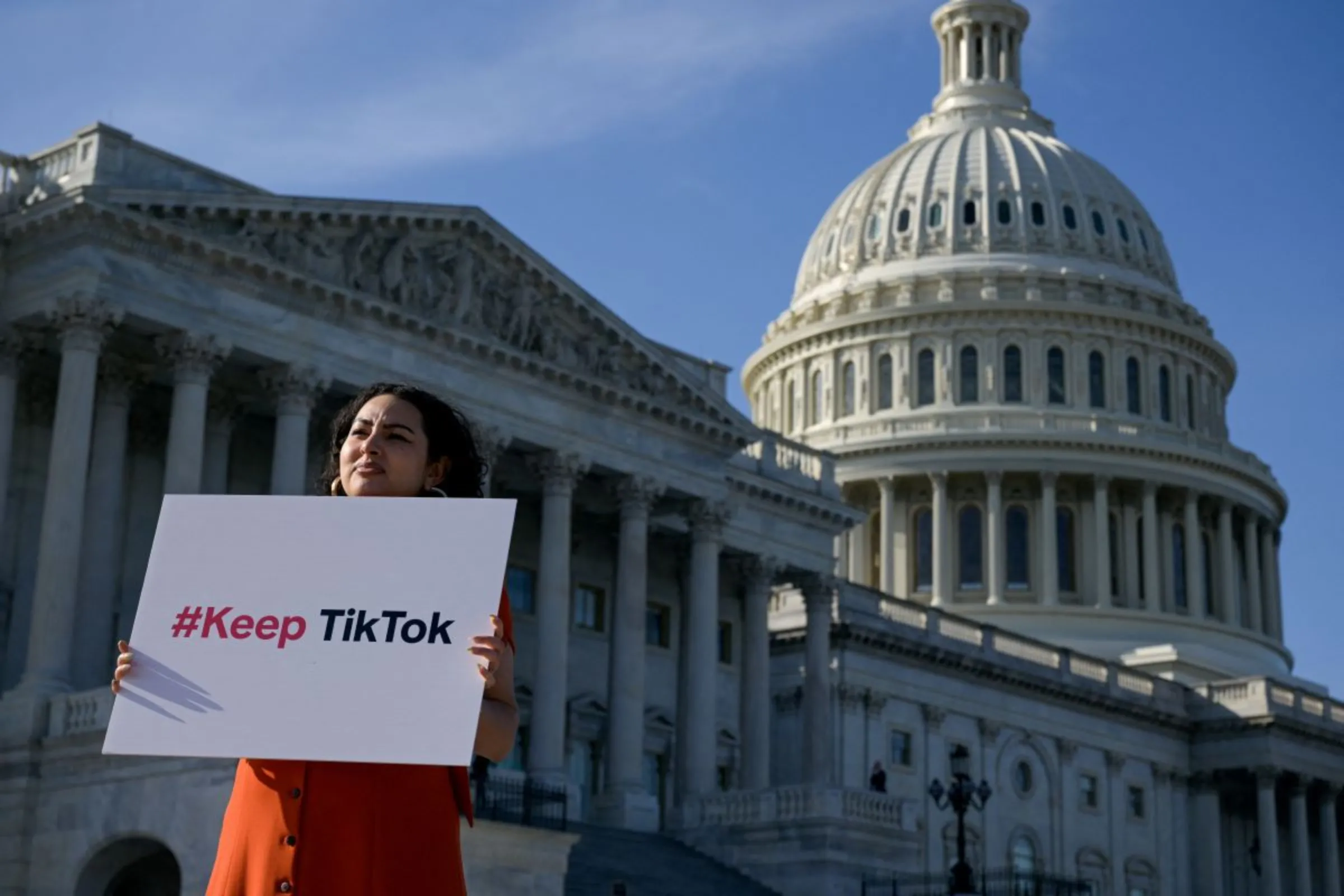 A demonstrator outside the U.S. Capitol, on Capitol Hill in Washington, U.S., March 12, 2024. REUTERS/Craig Hudson