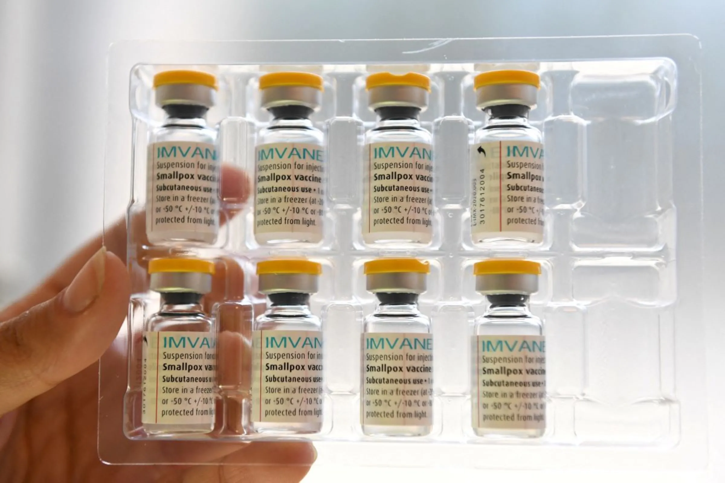 A person holds doses of Bavarian Nordic's Imvanex vaccine, used to protect against mpox virus, at the Edison municipal vaccination centre in Paris, France July 27, 2022. Alain Jocard/Pool via REUTERS/File Photo