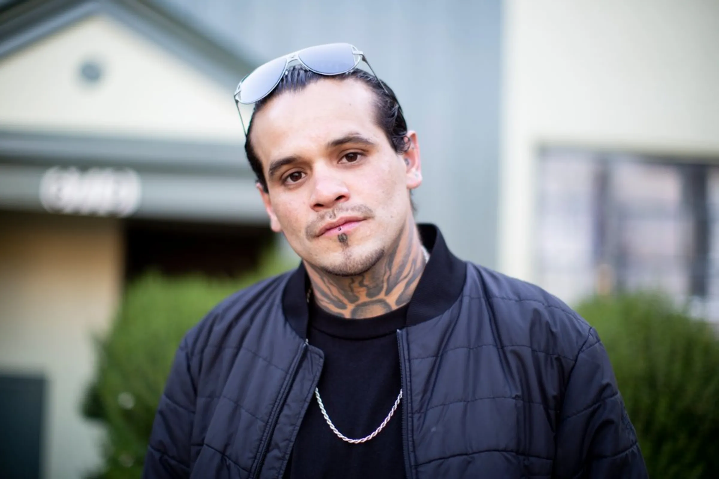Ex-gang member Ramon Ramos stands outside his mother’s apartment in North Hollywood, California, May 20, 2021