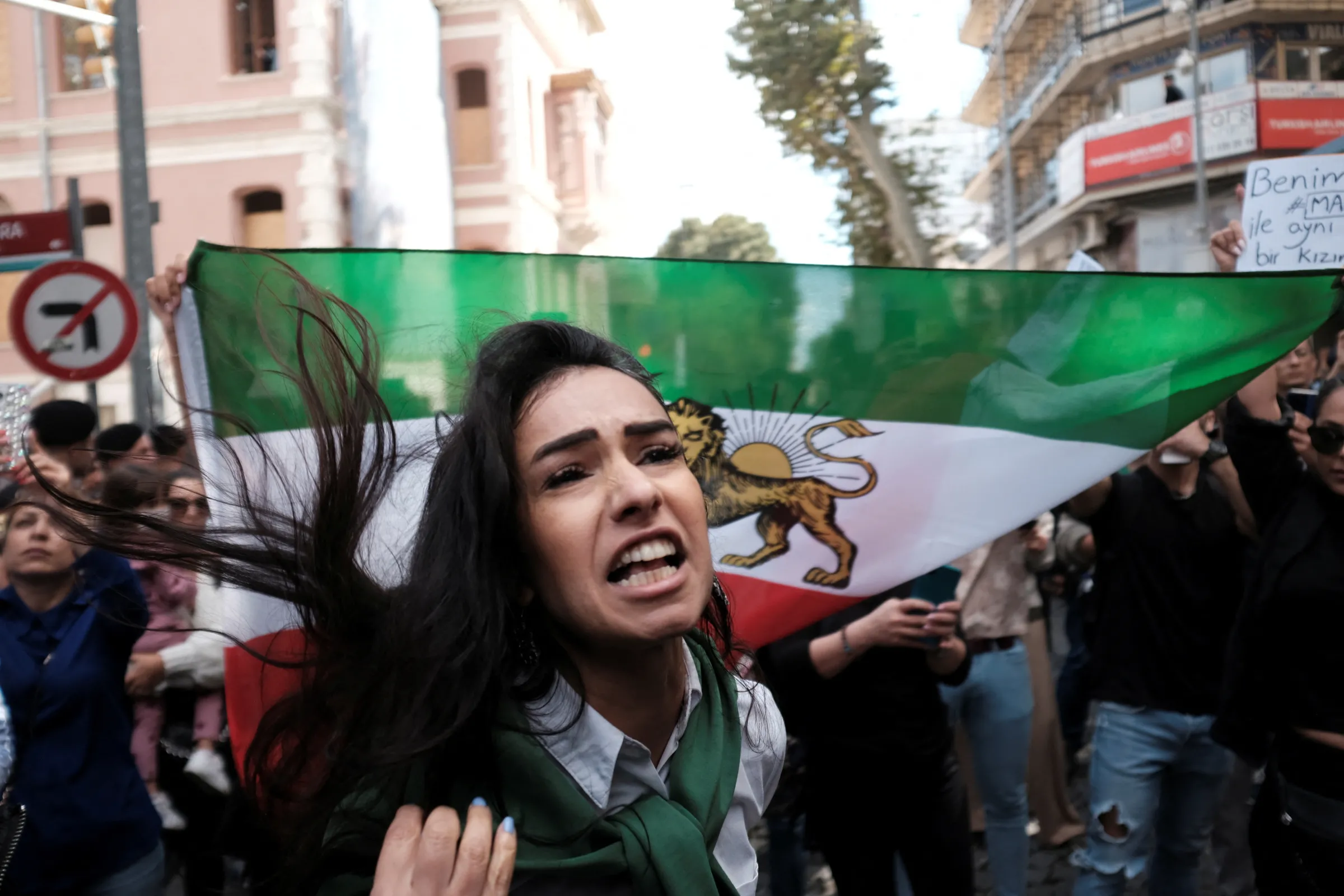 An Iranian woman living in Turkey reacts during a protest following the death of Mahsa Amini, outside the Iranian consulate in Istanbul, Turkey, September 21