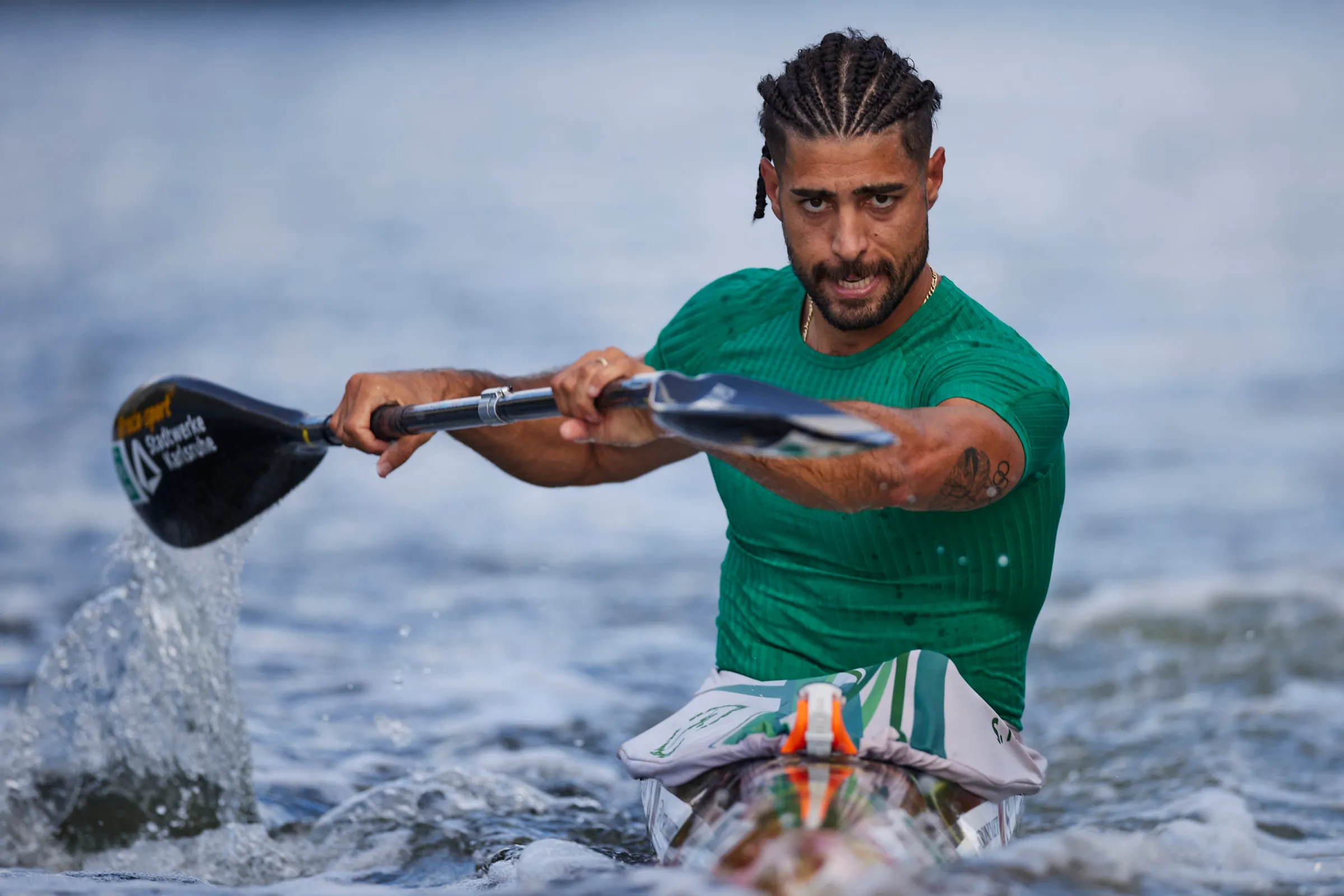 Iranian canoeist Saeid Fazloula of the Olympic refugee team trains in Bayeux, France, ahead of the Paris Olympics. Photo taken July 16, 2024. IOC/John Huet/Handout via Thomson Reuters Foundation