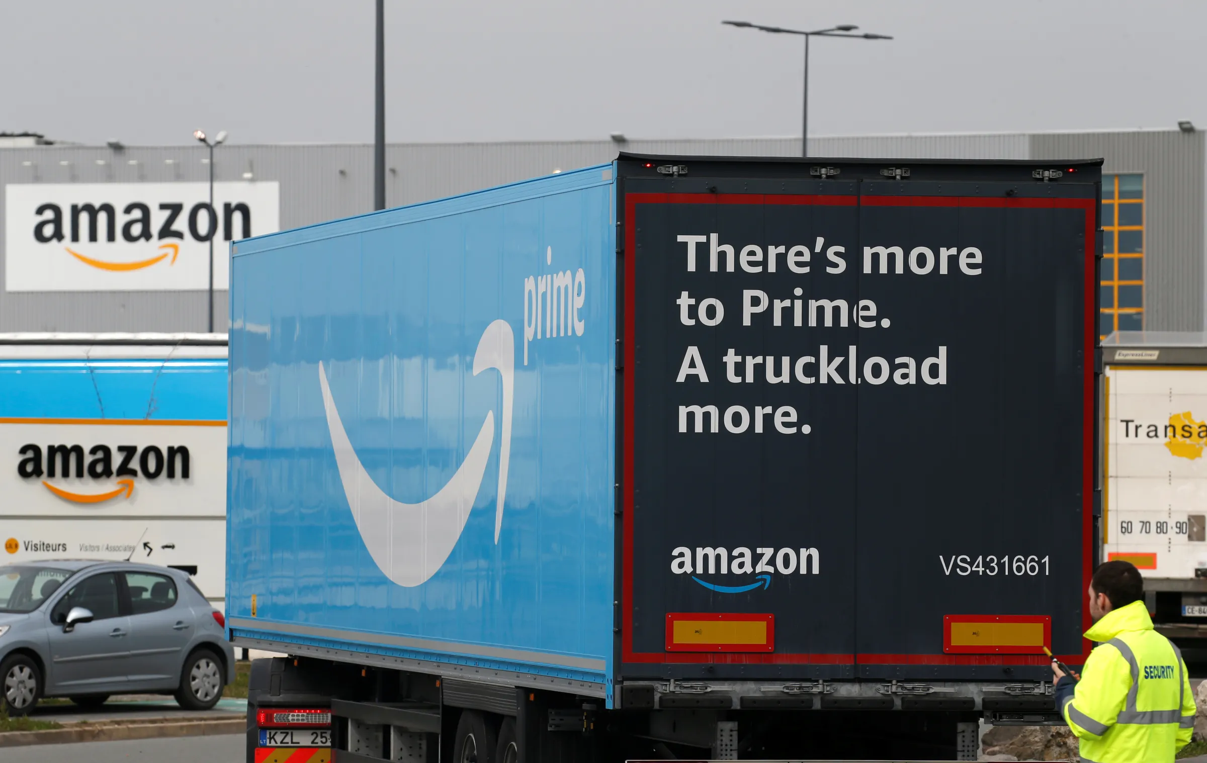 A truck with the logo of Amazon Prime Delivery arrives at the Amazon logistics center in Lauwin-Planque, northern France, March 19, 2020. REUTERS/Pascal Rossignol