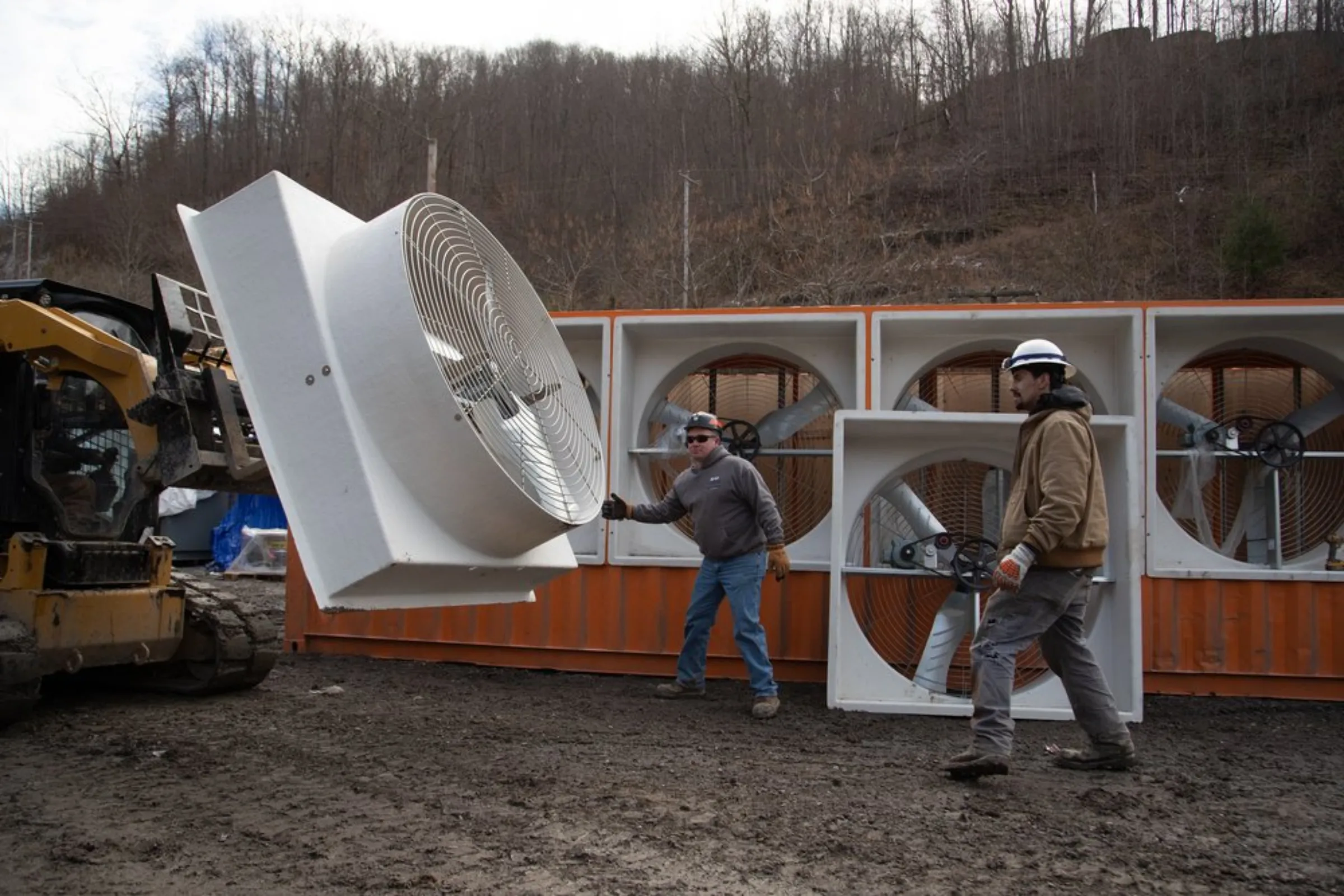Construction workers move fans on Blockware’s operation in Belfry, Kentucky, January 24, 2022. Thomson Reuters Foundation/Amira Karaoud