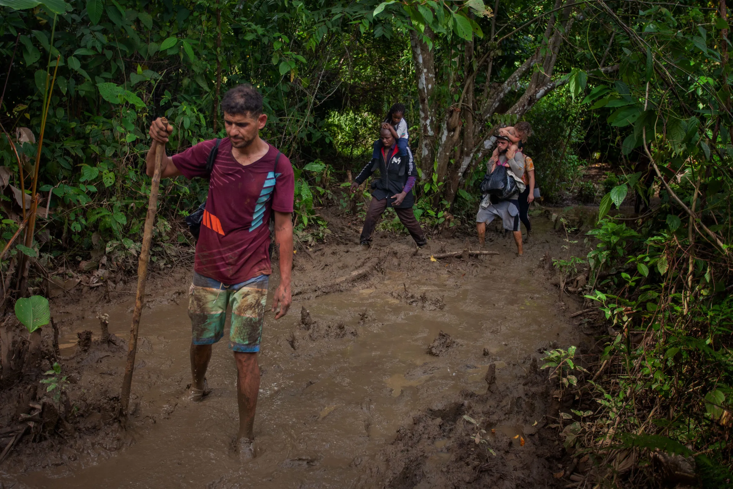 Migrants from Venezuela and African countries traverse dense jungle through the Darién Gap where people have died along the way and been targeted by attackers, according to aid groups. Darién Gap, Colombia July 27, 2022. Thomson Reuters Foundation/Fabio Cuttica