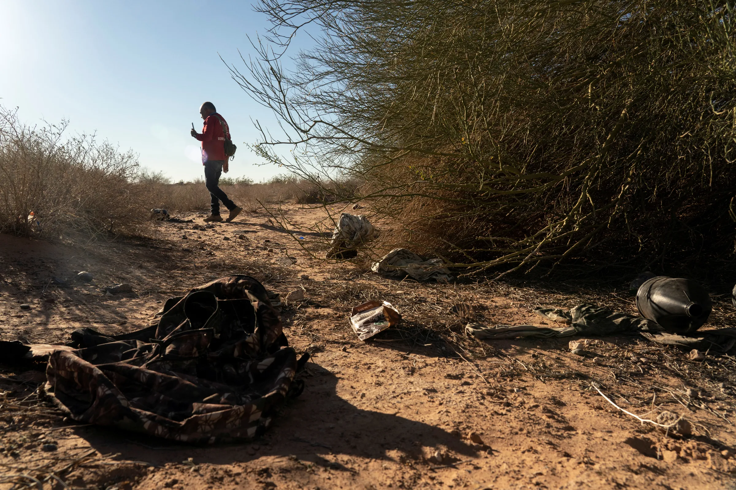 Member of the search and rescue team Paralelo 31, walks in a desert while on a search mission for the corpse of migrants in Agua Caliente, Arizona, U.S., February 19, 2022