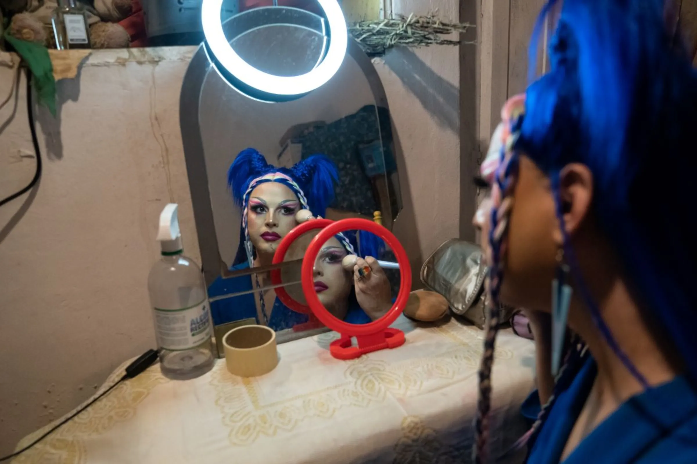 Dislexia Severa touches up backstage before walking the runway at a late-night drag show in Asunción, Paraguay, February 22, 2023