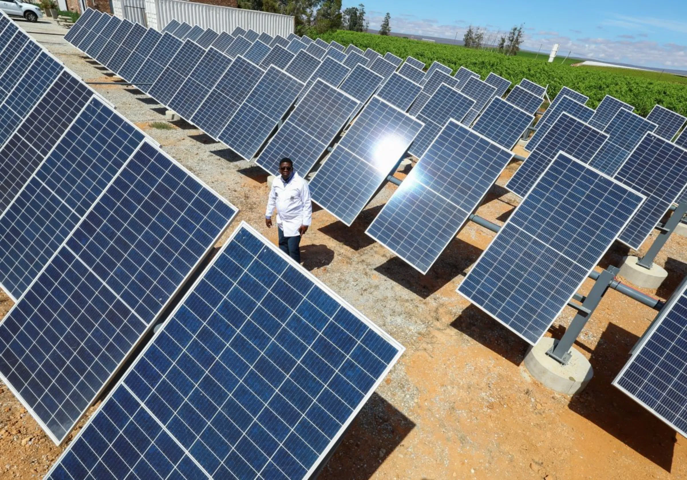 Dr Stanford Chidziva, acting director of Green Hydrogen, looks at the solar panels at the site where Keren Energy constructed the first proof of concept of green hydrogen production facility in Africa at Namaqua Engineering in Vredendal, in collaboration with The Green Hydrogen Institute for Advanced Materials Chemistry (SAIAMC) at the University of the Western Cape, South Africa, November 15, 2022. REUTERS/Esa Alexander 