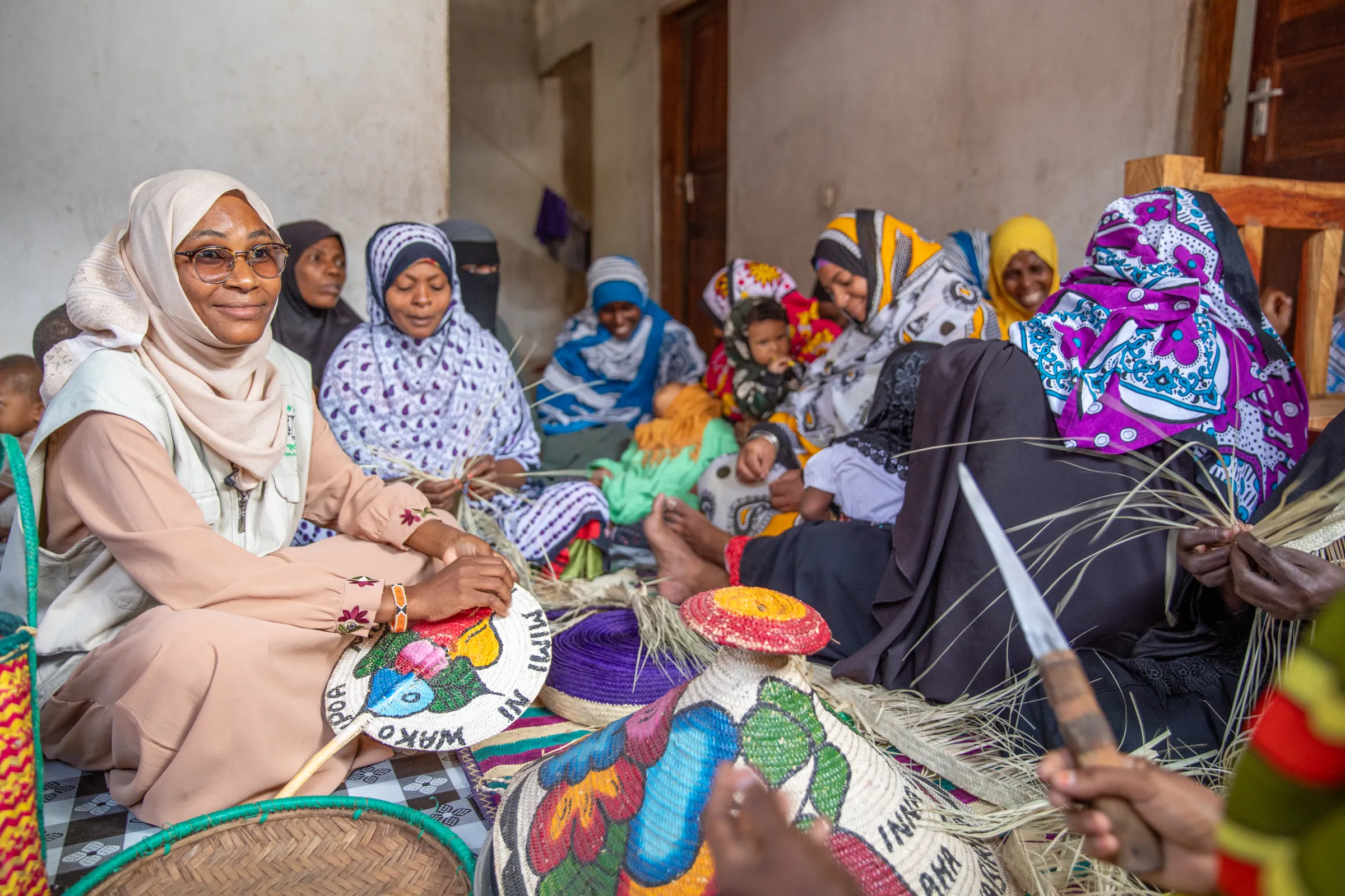 Barke Hamisi, 30, spends time with members of the Pemba community in Watamu, Kenya on 13 July, 2023. Hamisi, a paralegal, is one of 7,000 members of the stateless Pemba community in Kenya who gained recognition in 2022. UNHCR/Handout via Thomson Reuters Foundation