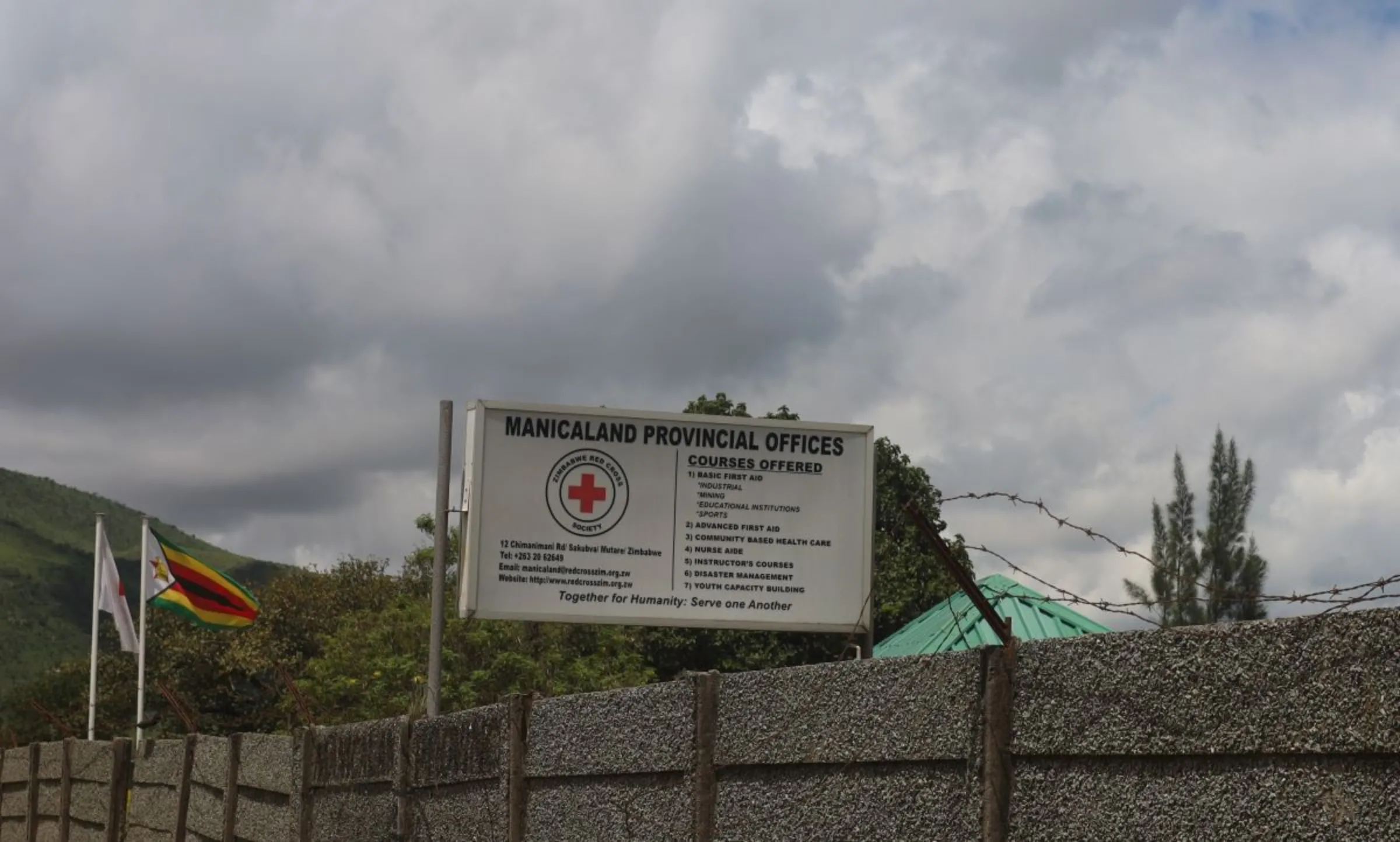 A sign at a Red Cross centre advertises its popular nurse aide courses in Mutare in eastern Zimbabwe. January 5, 2024. Thomson Reuters Foundation/Farai Shawn Matiashe
