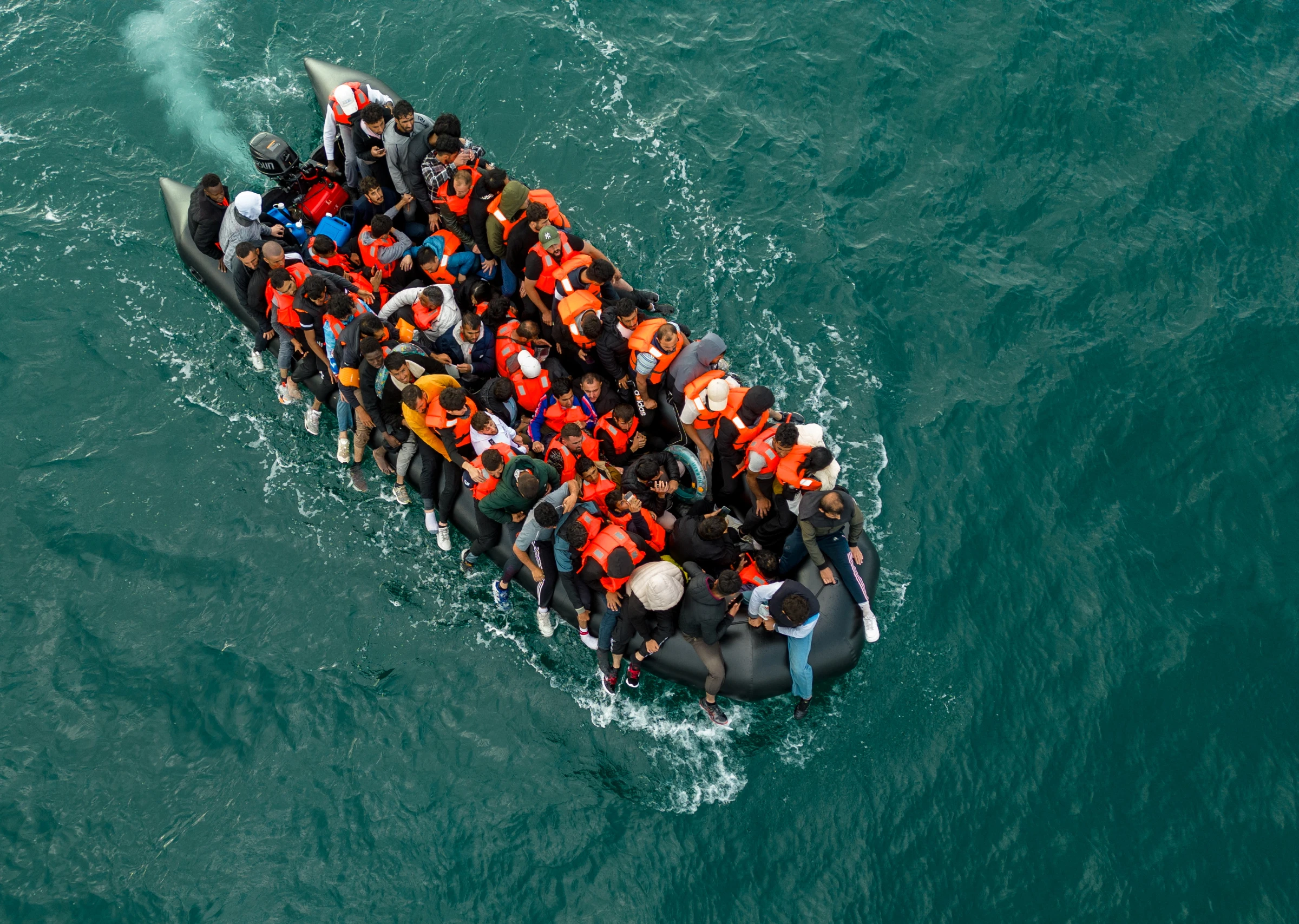 This drone view shows an inflatable dinghy carrying migrants crossing the English Channel towards Britain on August 6, 2024. REUTERS/Chris J. Ratcliffe