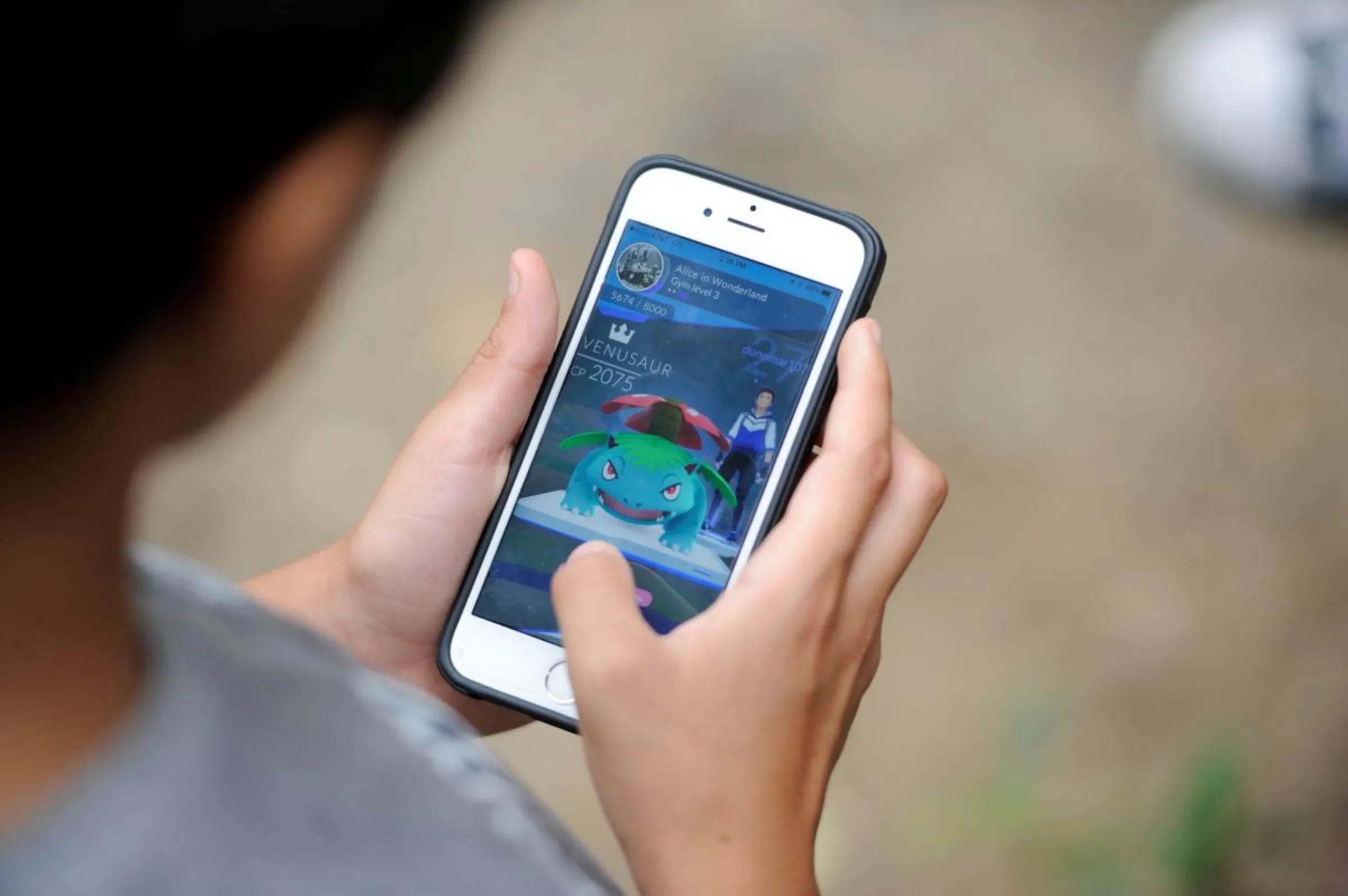 A boy plays Pokemon Go, New York, U.S., September 3, 2016. REUTERS/Mark Kauzlarich