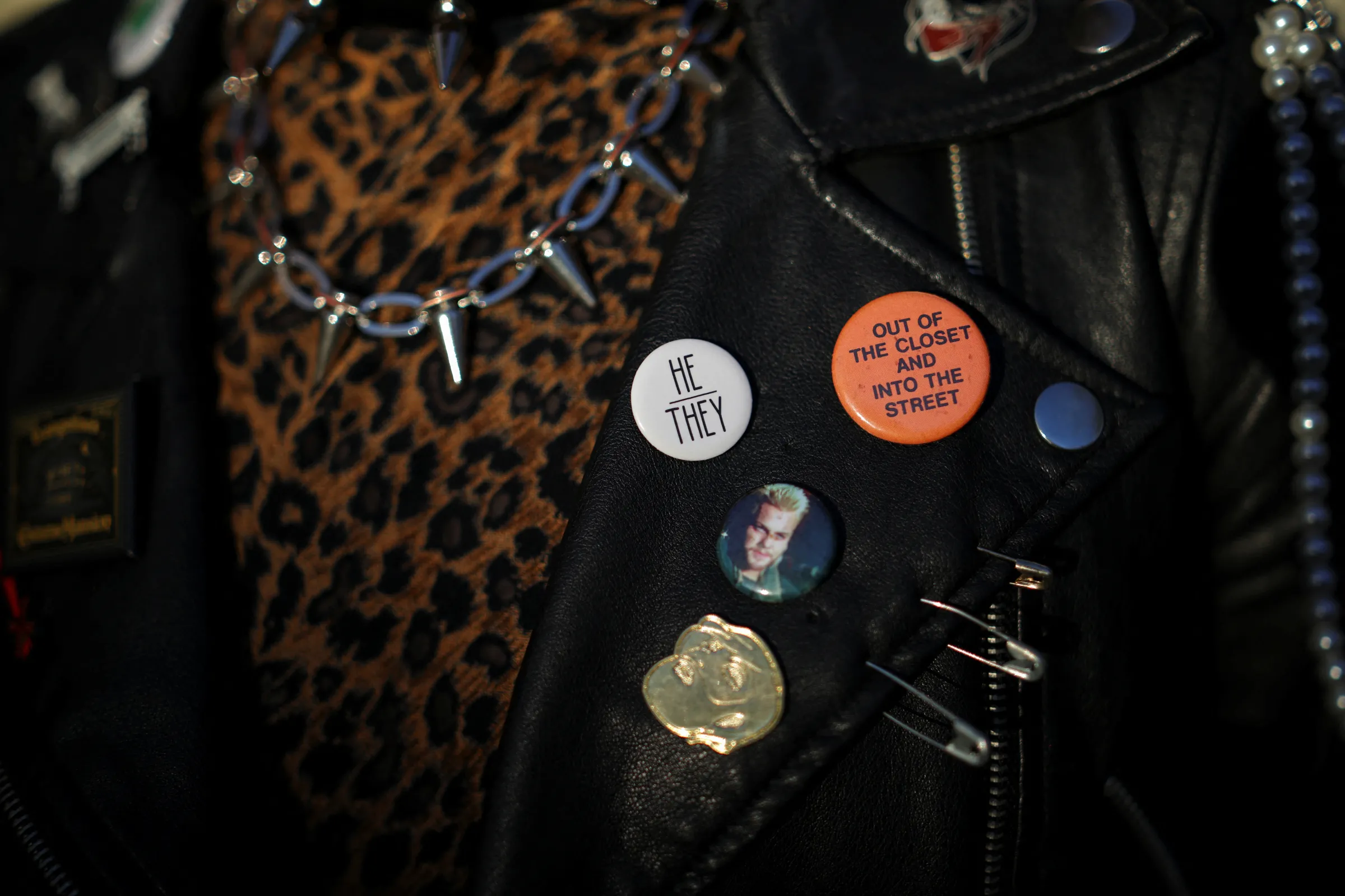 A person shows their badges at the Connie Norman Transgender Empowerment Center in Los Angeles, California, U.S. December 17, 2024. REUTERS/Daniel Cole