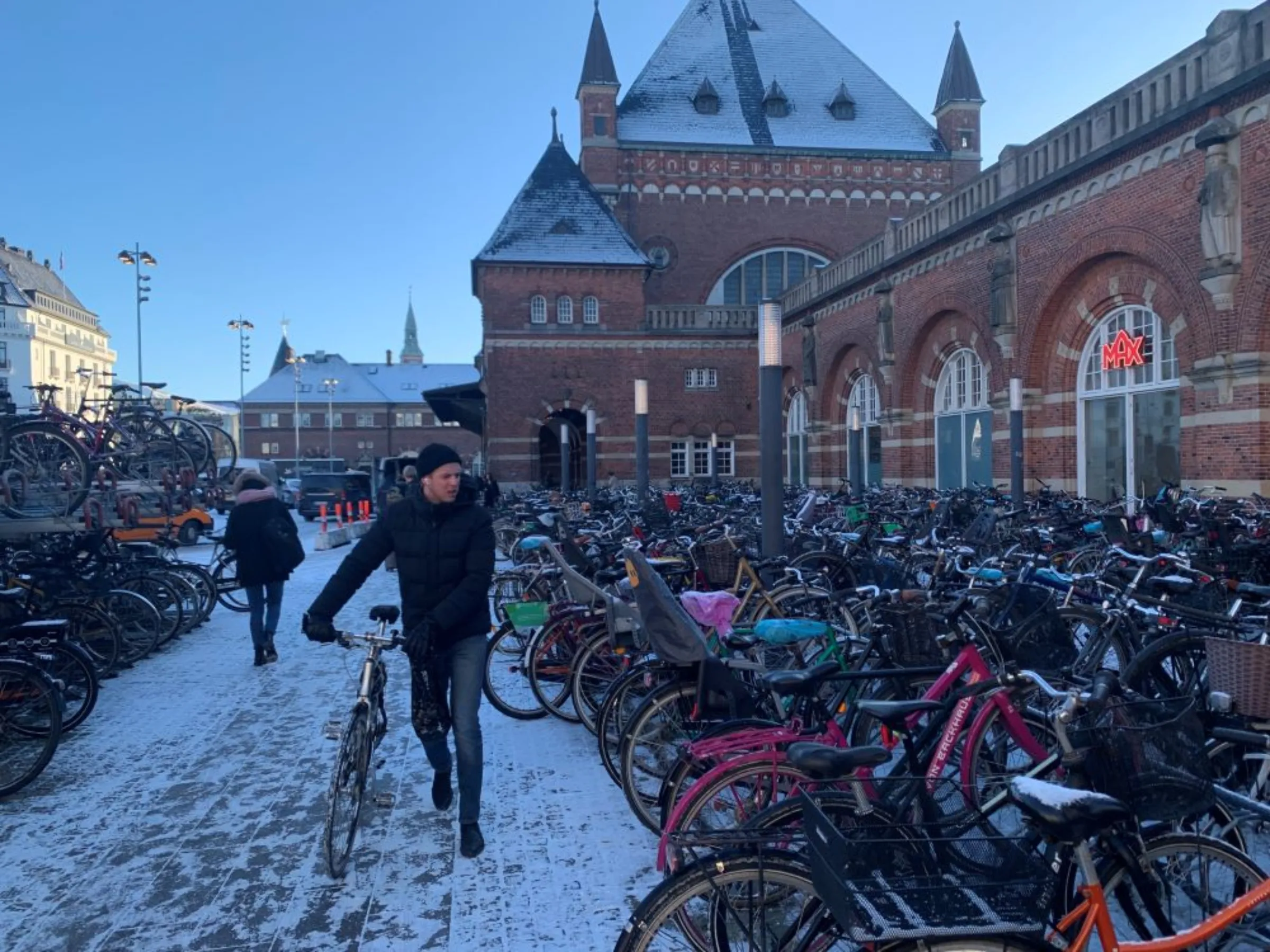 A commuter searches for a place to park his bicycle outside Copenhagen’s central station, March 28, 2023