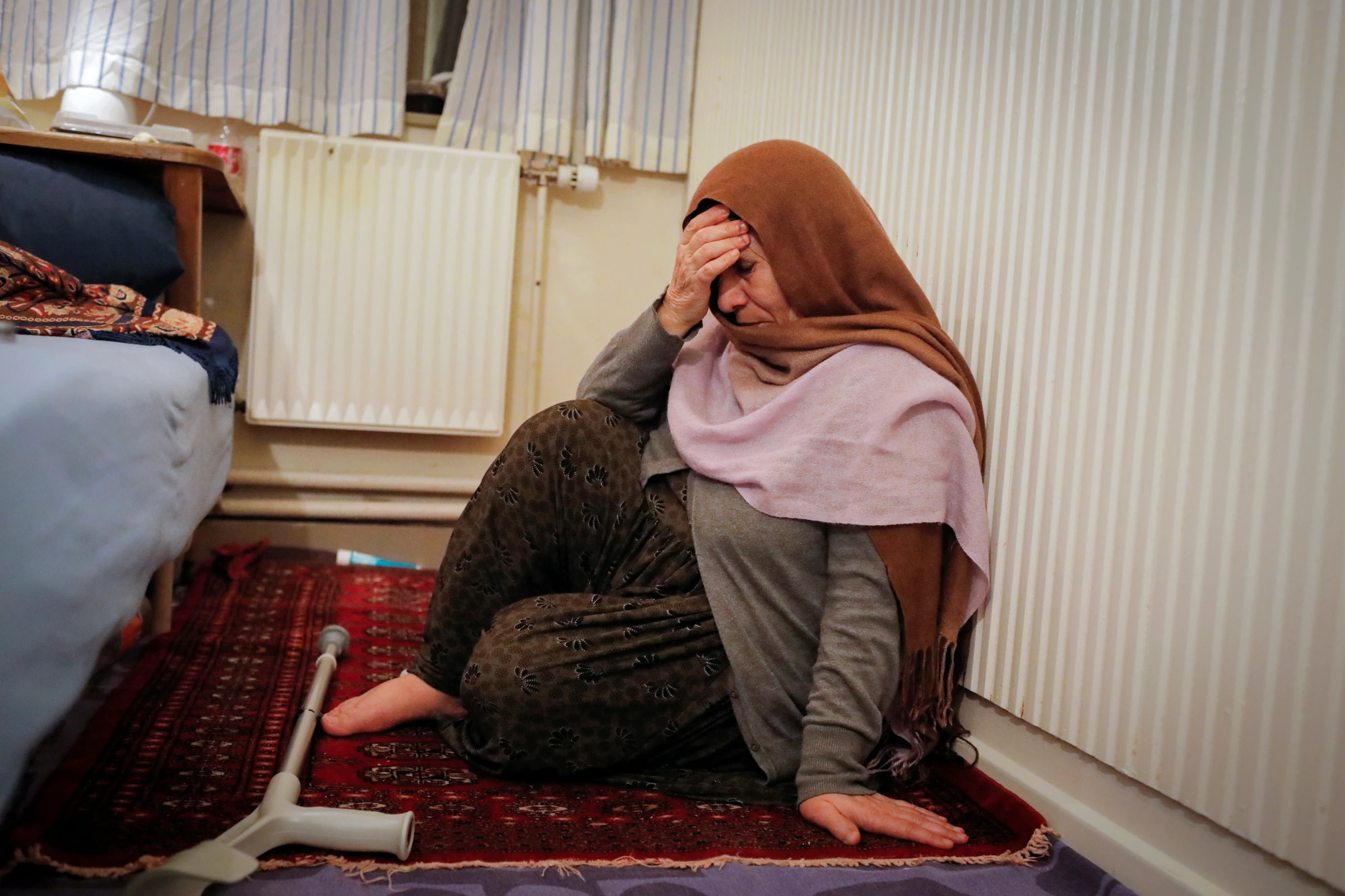 A woman from Afghanistan sits in her room at Kaershovedgaard, a former prison and now a departure centre for rejected asylum seekers in Jutland, Denmark, March 27, 2019. REUTERS/Andrew Kelly