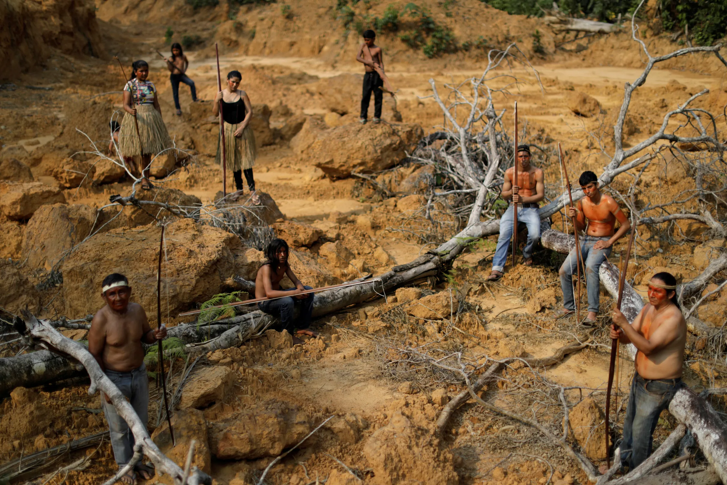 Indigenous people from the Mura tribe show a deforested area in unmarked indigenous lands inside the Amazon rainforest near Humaita, Amazonas State, Brazil August 20, 2019