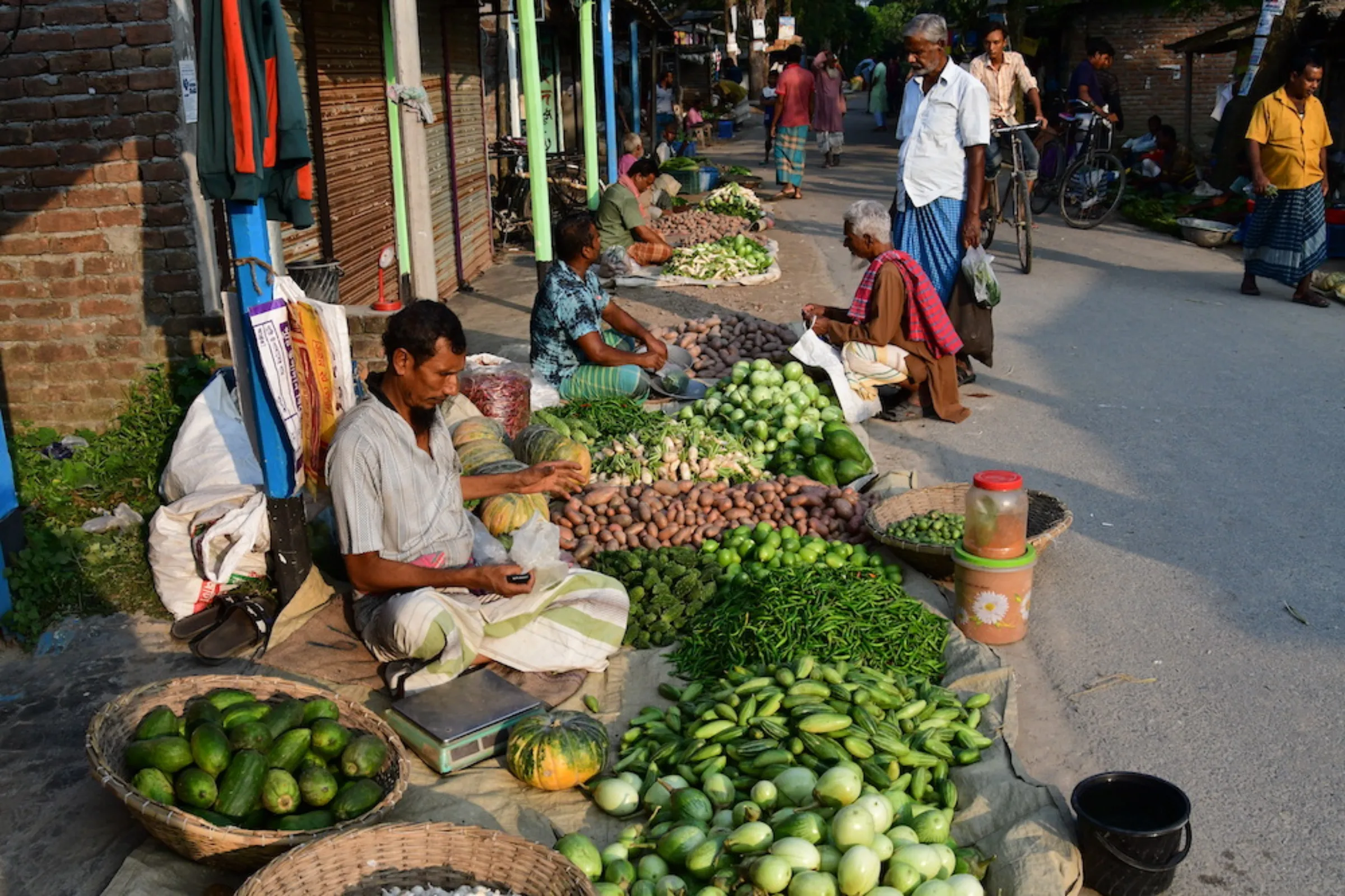 Farmers selling their vegetables in a village market in Natore district, where the climate is too dry to grow rice, in Rajshahi, Bangladesh, on October 28, 2022