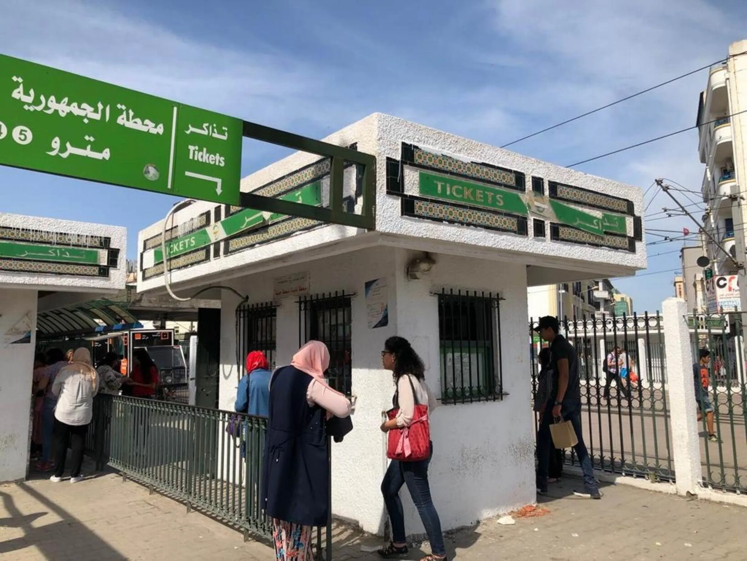 Tunisian women seen in front of a metro station in Tunis on June 17, 2019